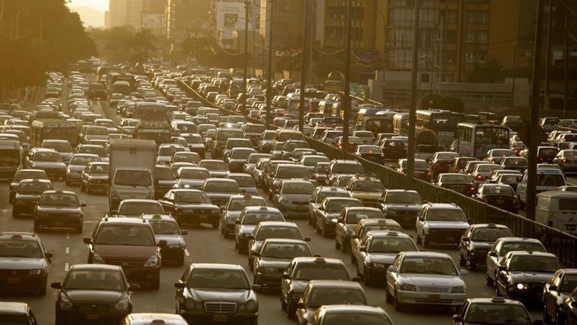 Cars sit in a traffic jam in Lima