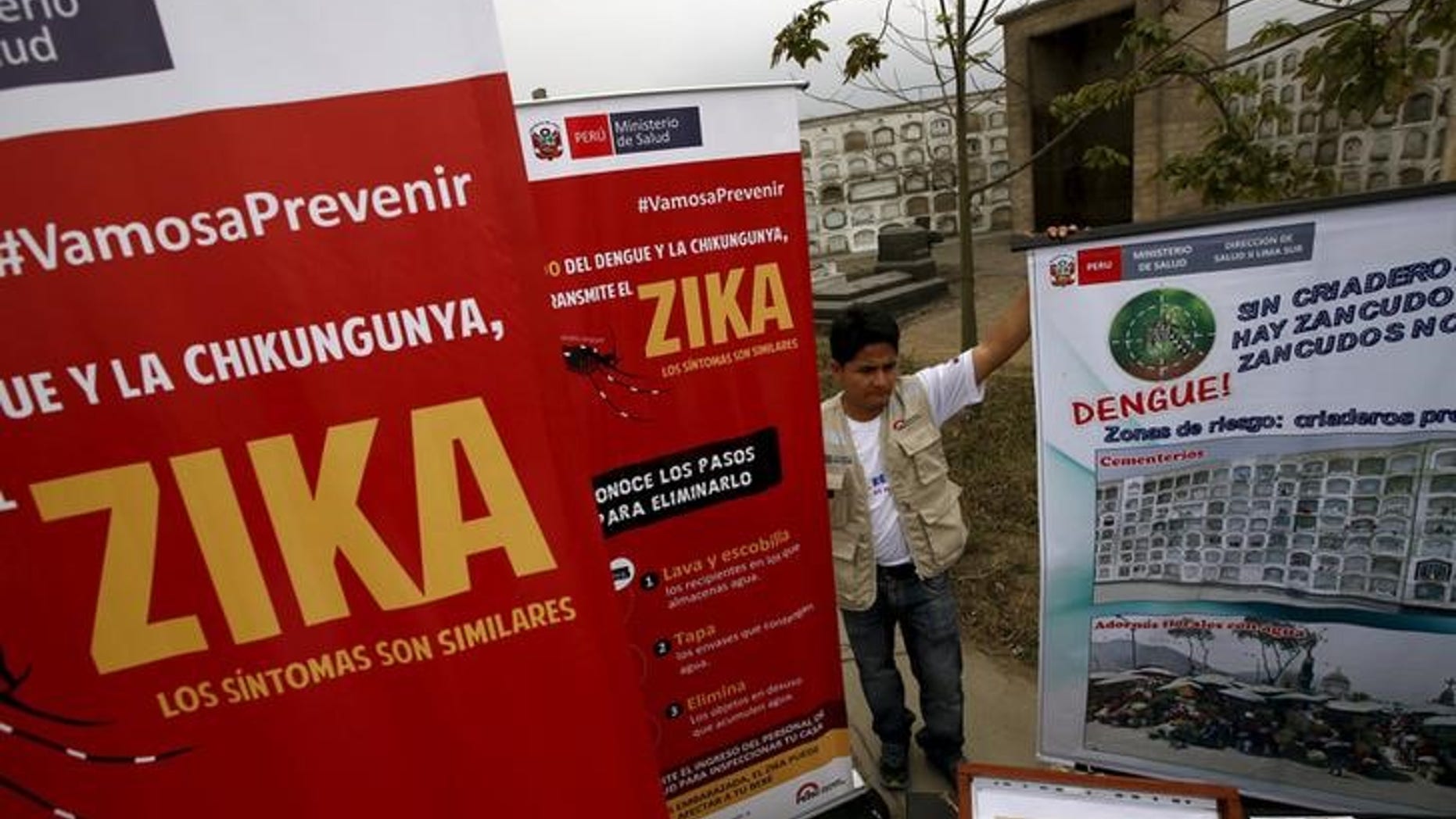 A health worker gives information during a preventive campaign against the Zika virus and other mosquito-borne diseases, at the cemetery of Presbitero Maestro in Lima