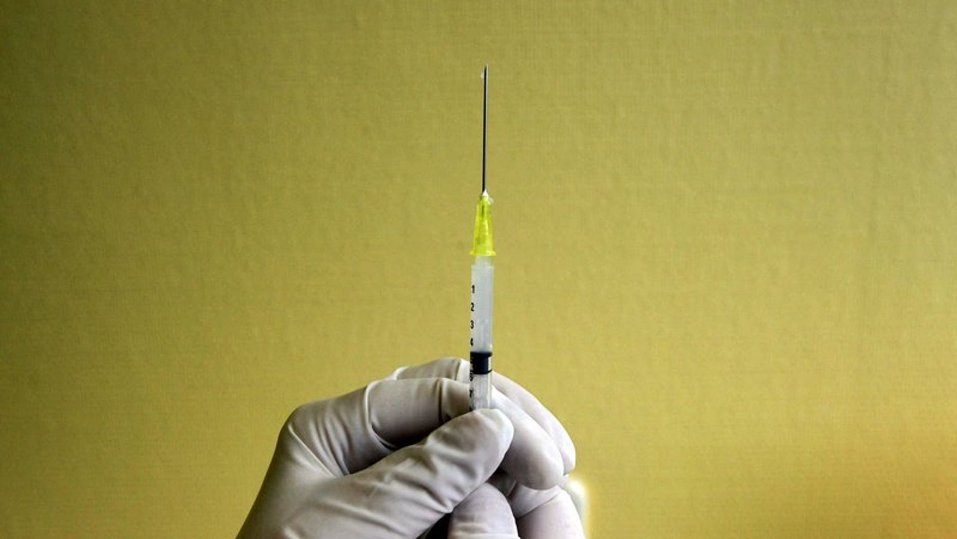 File photo of a nurse preparing an H1N1 flu vaccine shot at a hospital in Budapest