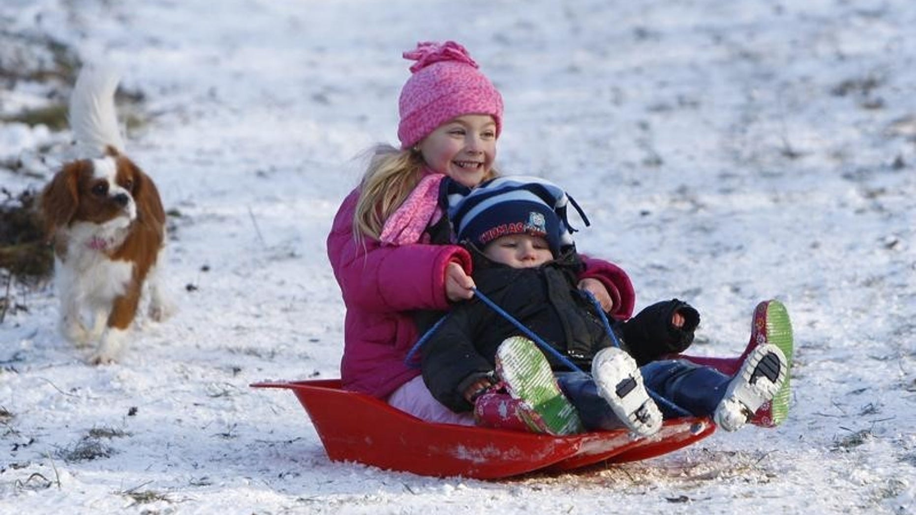 Youngsters toboggan in Princes Risborough, southern England