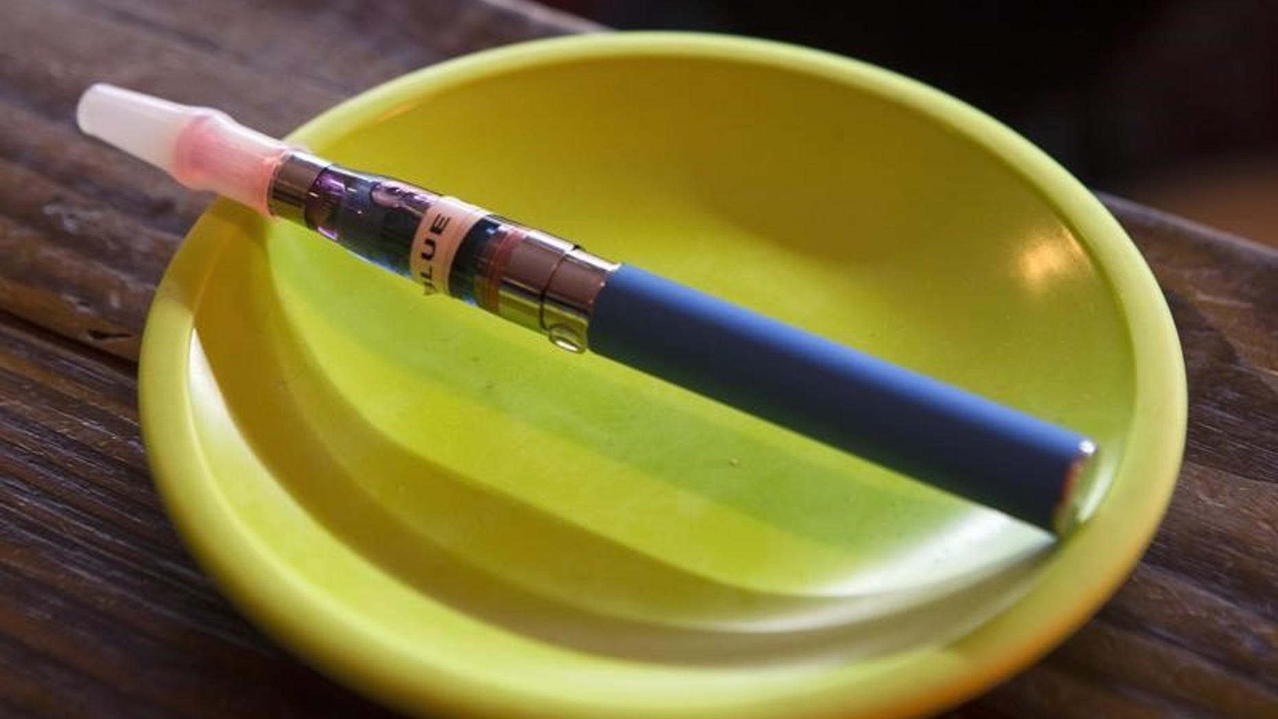 An e-cigarette sits in a tray on the bar at the Henley Vaporium in New York City