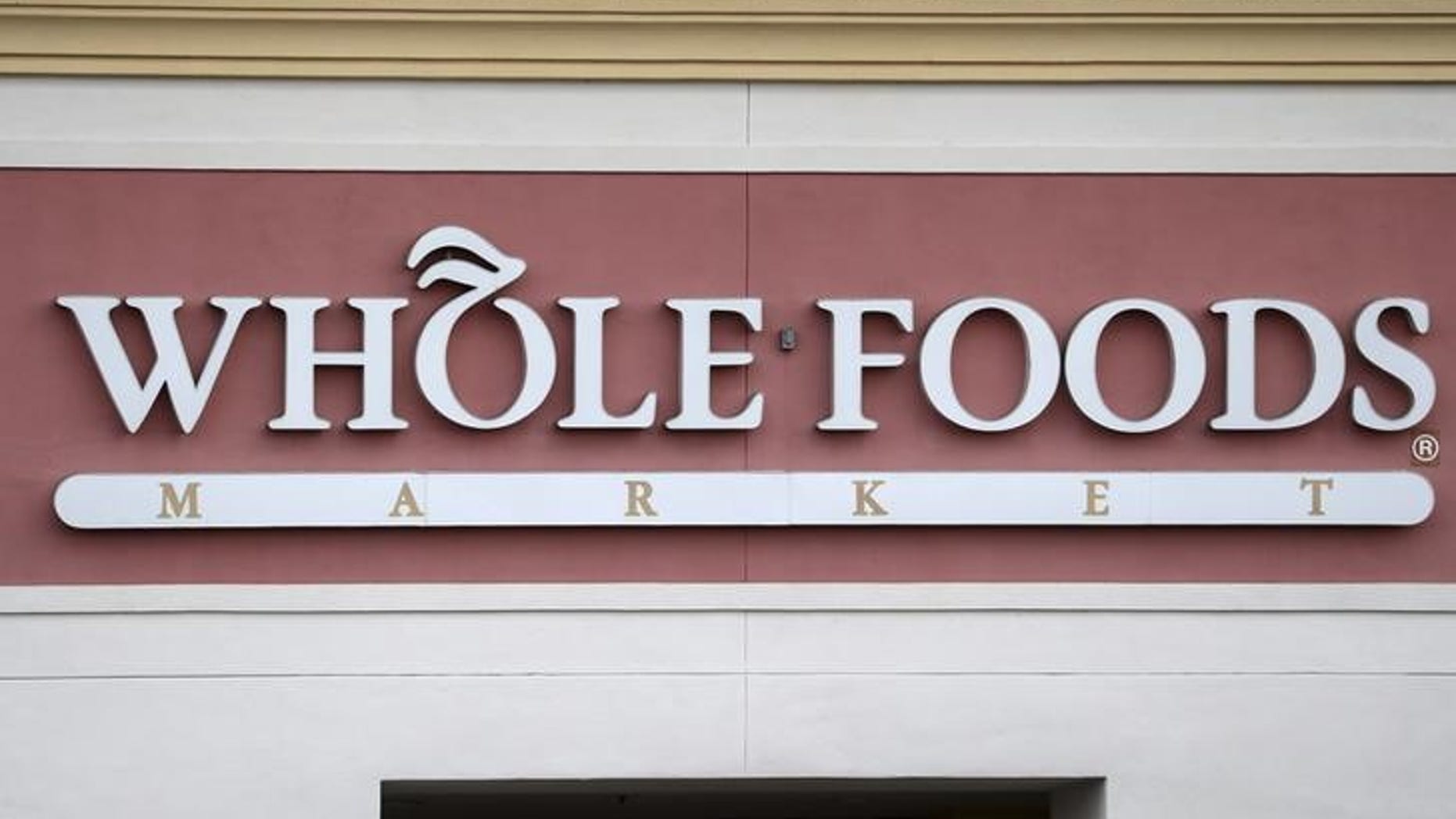 A Whole Foods Market store logo is pictured on a building in Boca Raton, Florida