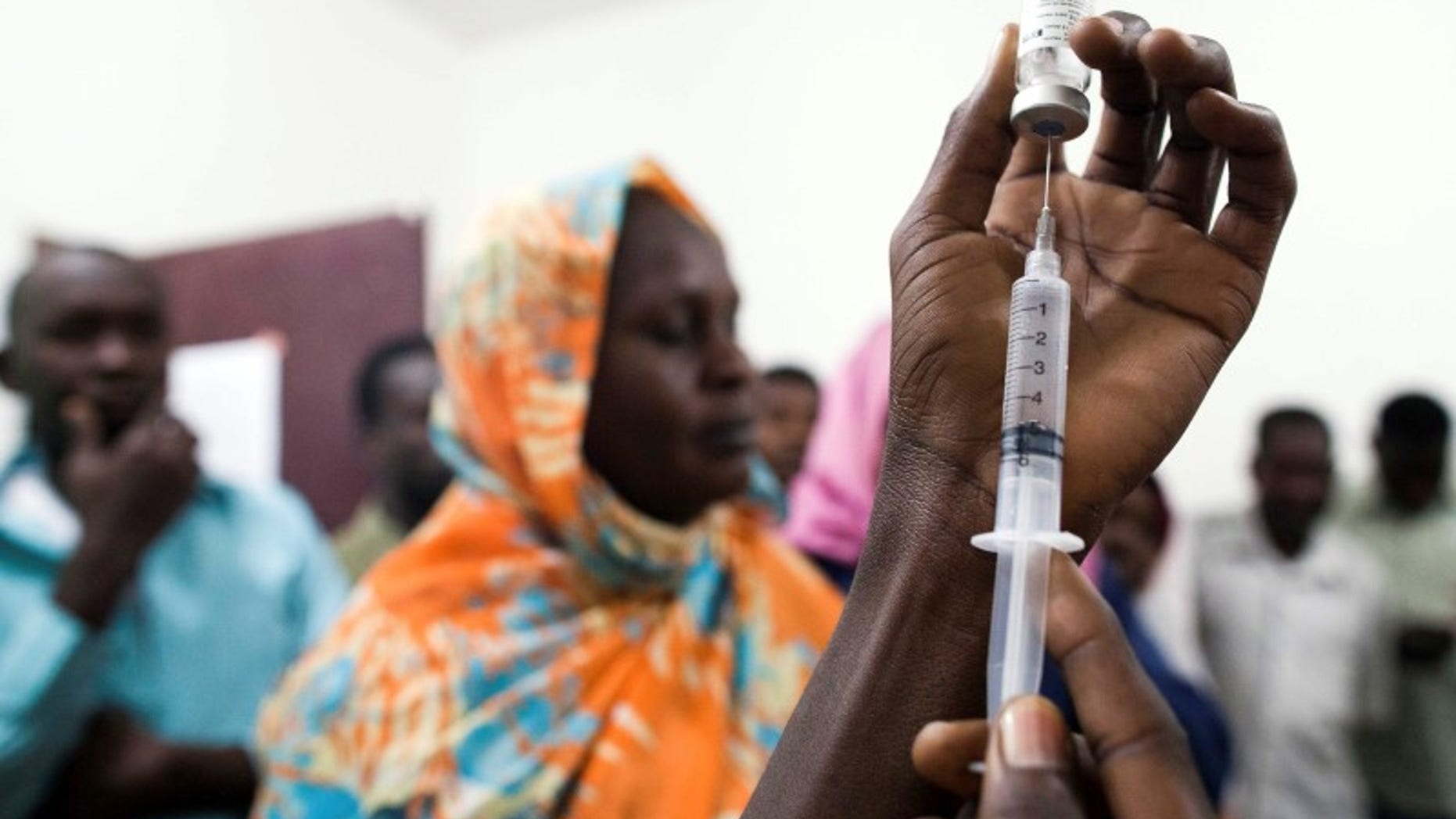 Handout of staff of the Teaching Hospital receiving the first vaccination treatment for yellow fever in El Geneina, West Darfur