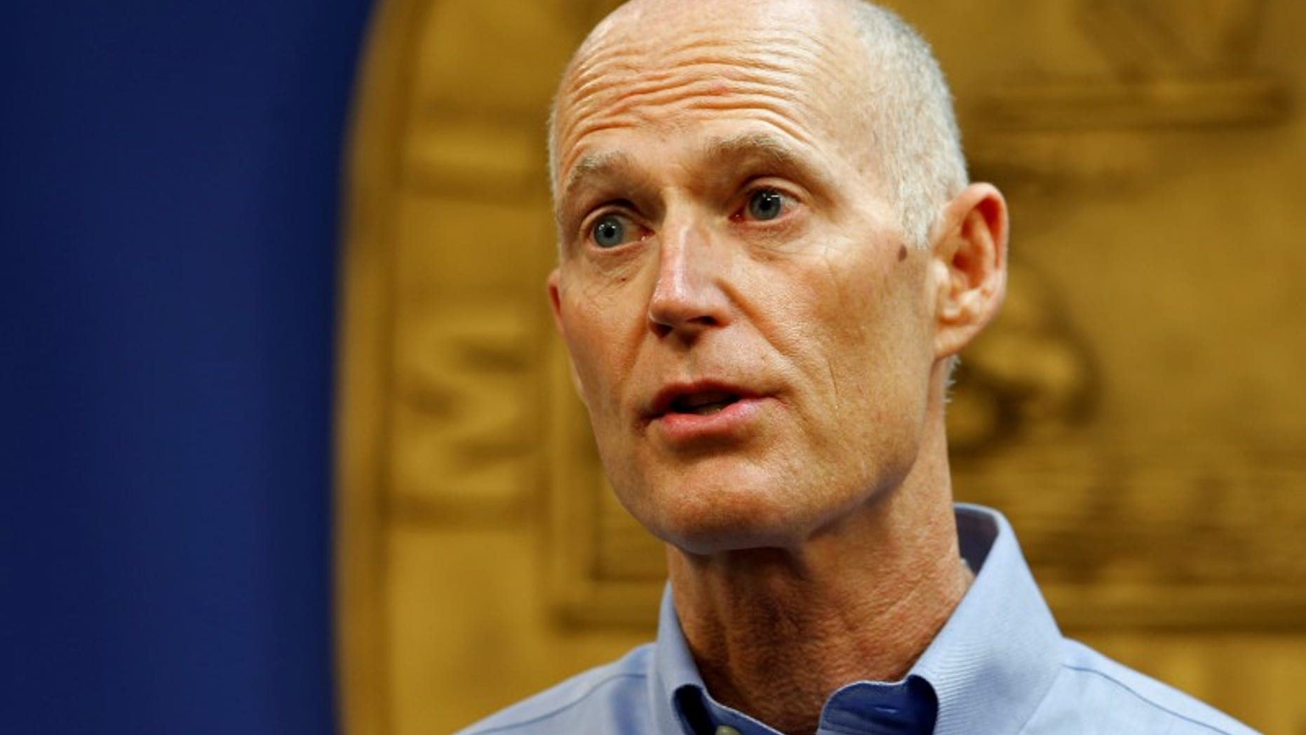 Florida Gov. Rick Scott speaks at a press conference about the Zika virus in Doral