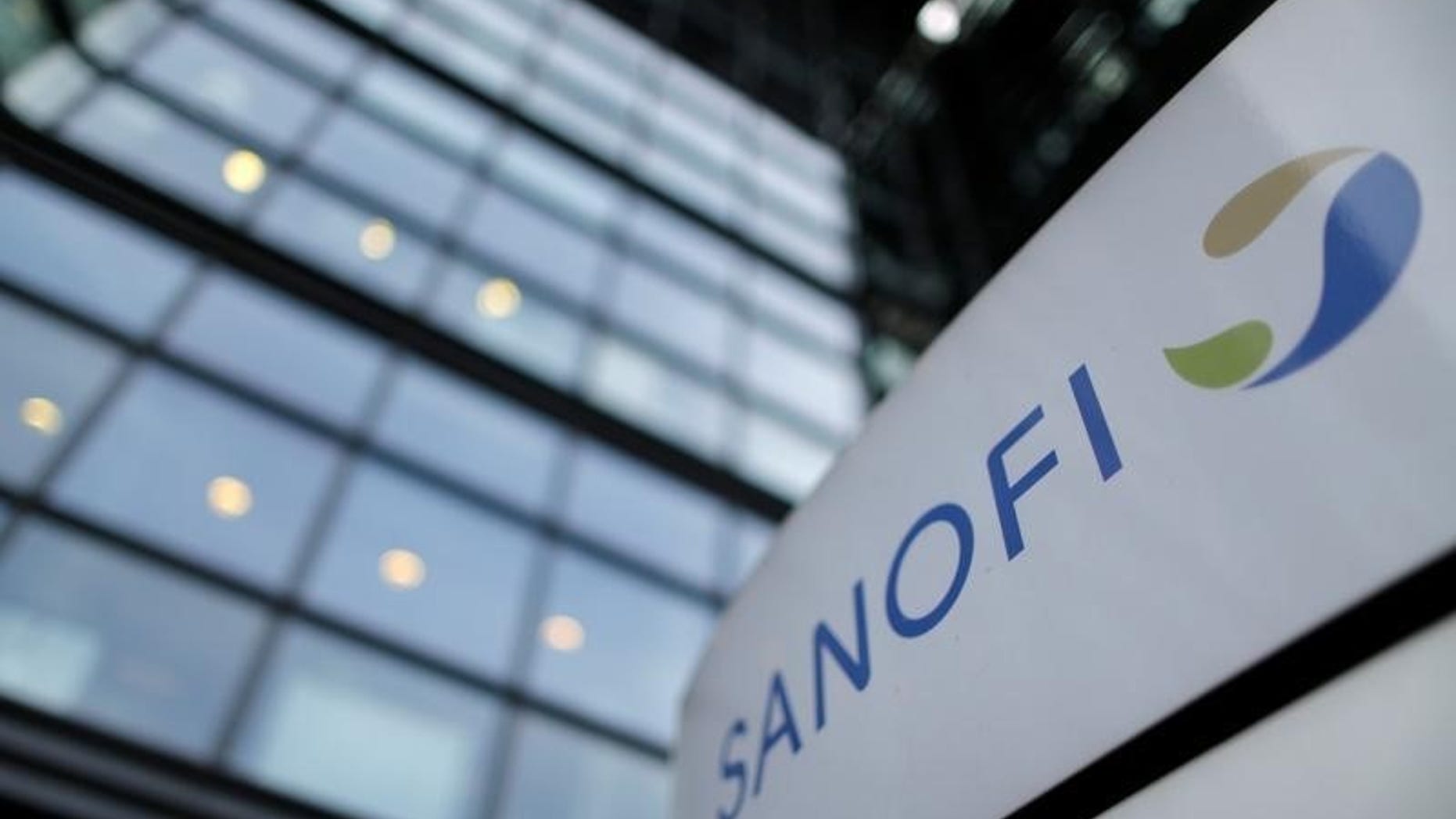 A logo is seen in front of the entrance at the headquarters of French drugmaker Sanofi in Paris