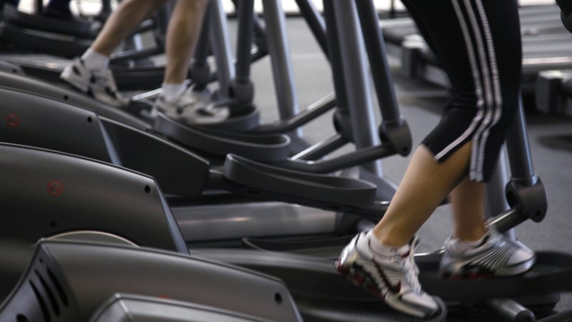 Clients work out on machines at the Bally Total Fitness facility in Arvada