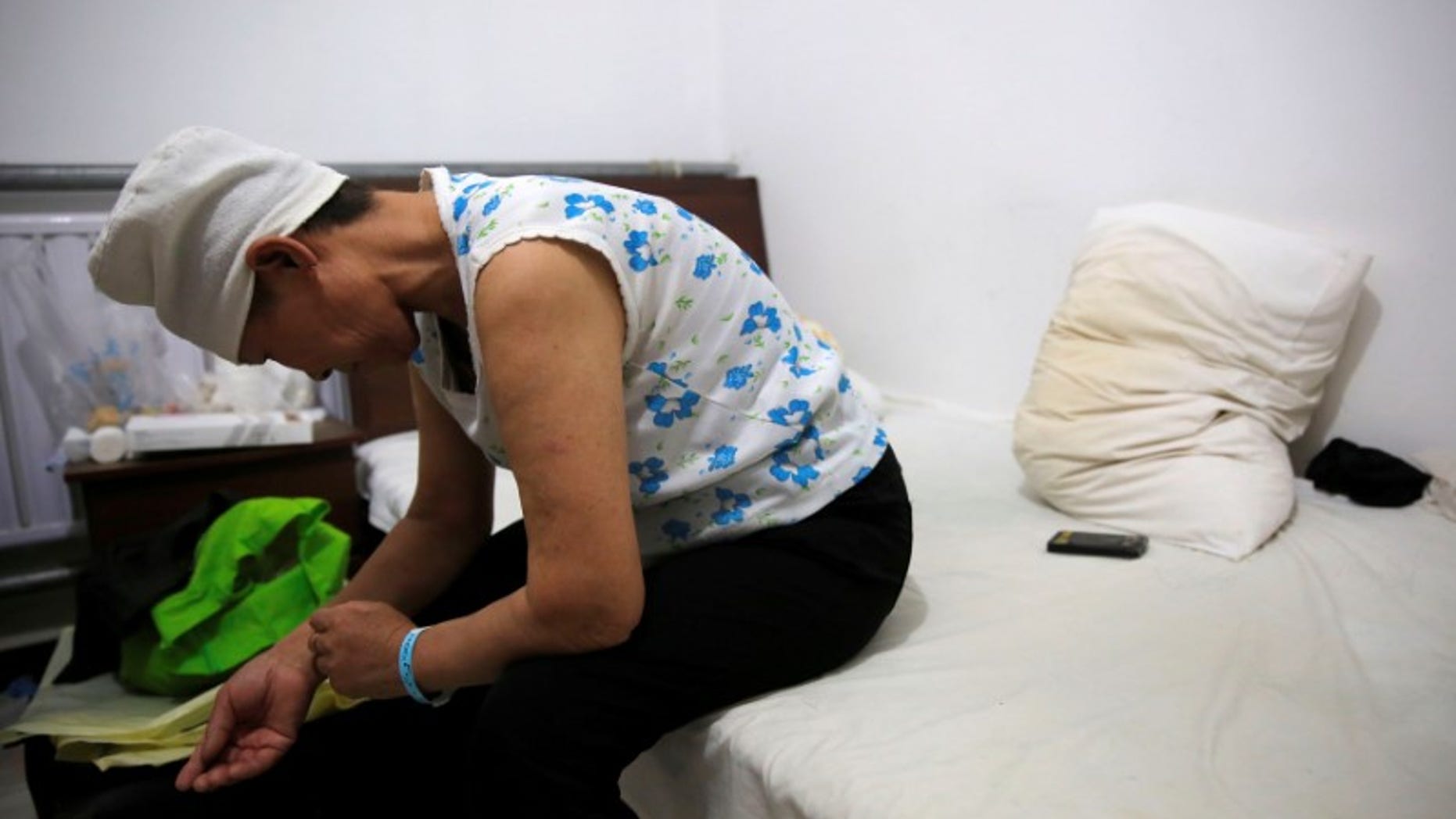 The Wider Image: China's cancer patients far from home