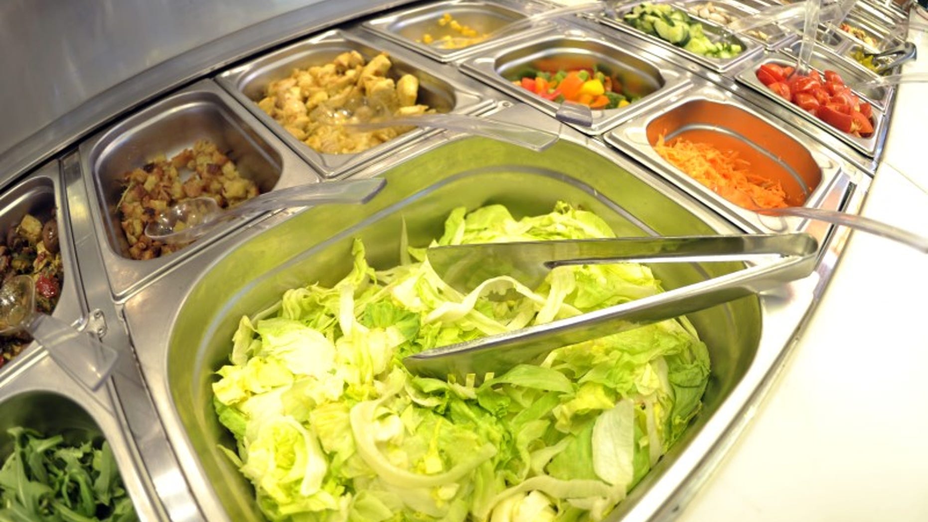 Pre-cut vegetables of self service salad bar are displayed for sale in shop in northern German town of Hamburg
