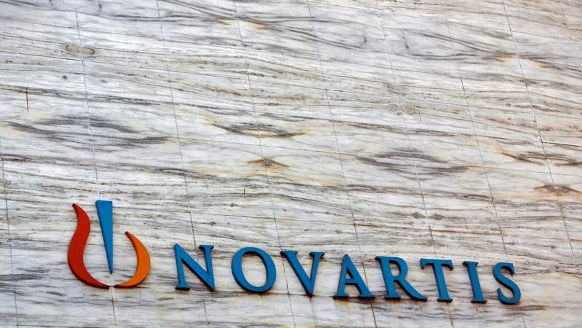 A Novartis logo is pictured on its headquarters building in Mumbai