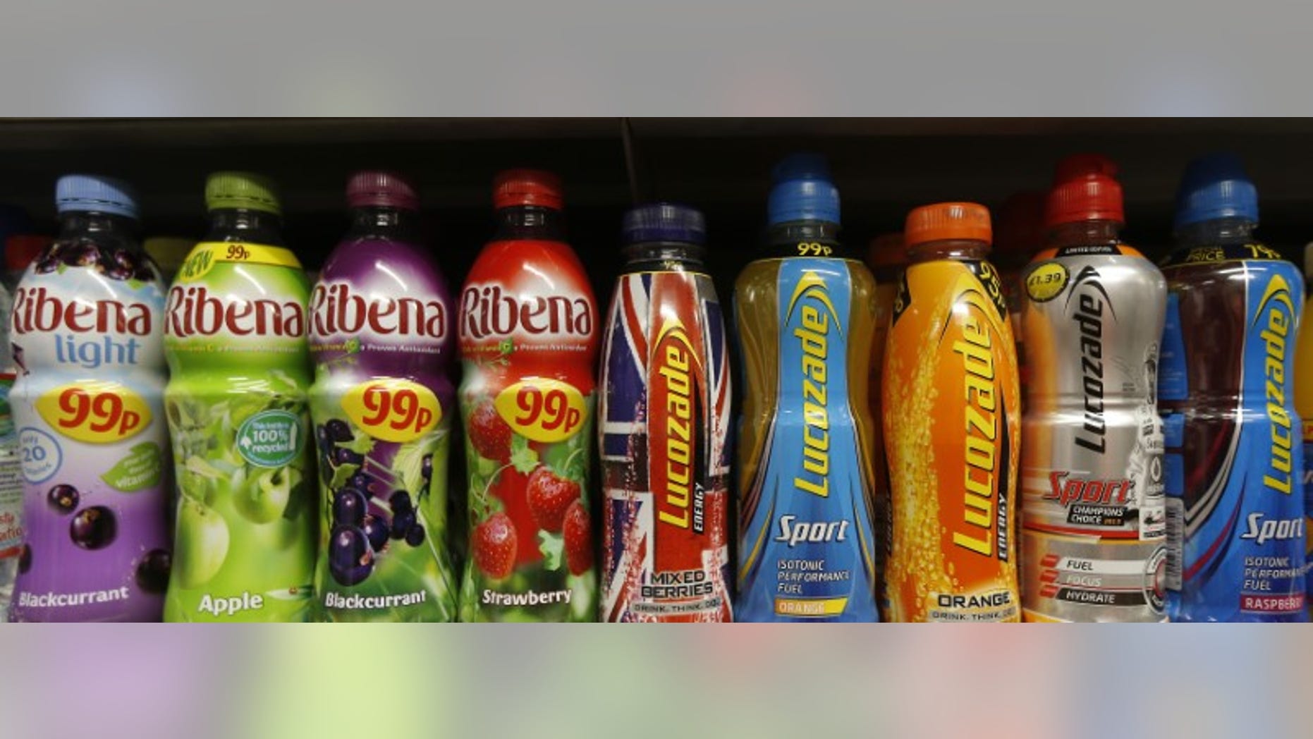 File photograph of soft drinks bottles displayed on a shelf in a shop in London