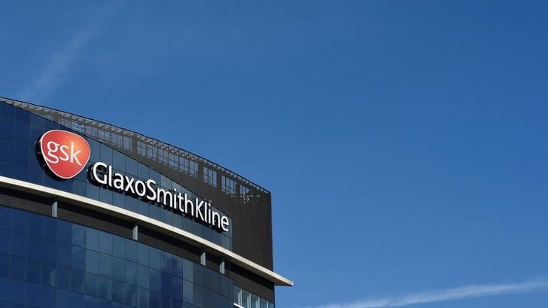 Signage for GlaxoSmithKline is seen on it's offices in London, Britain