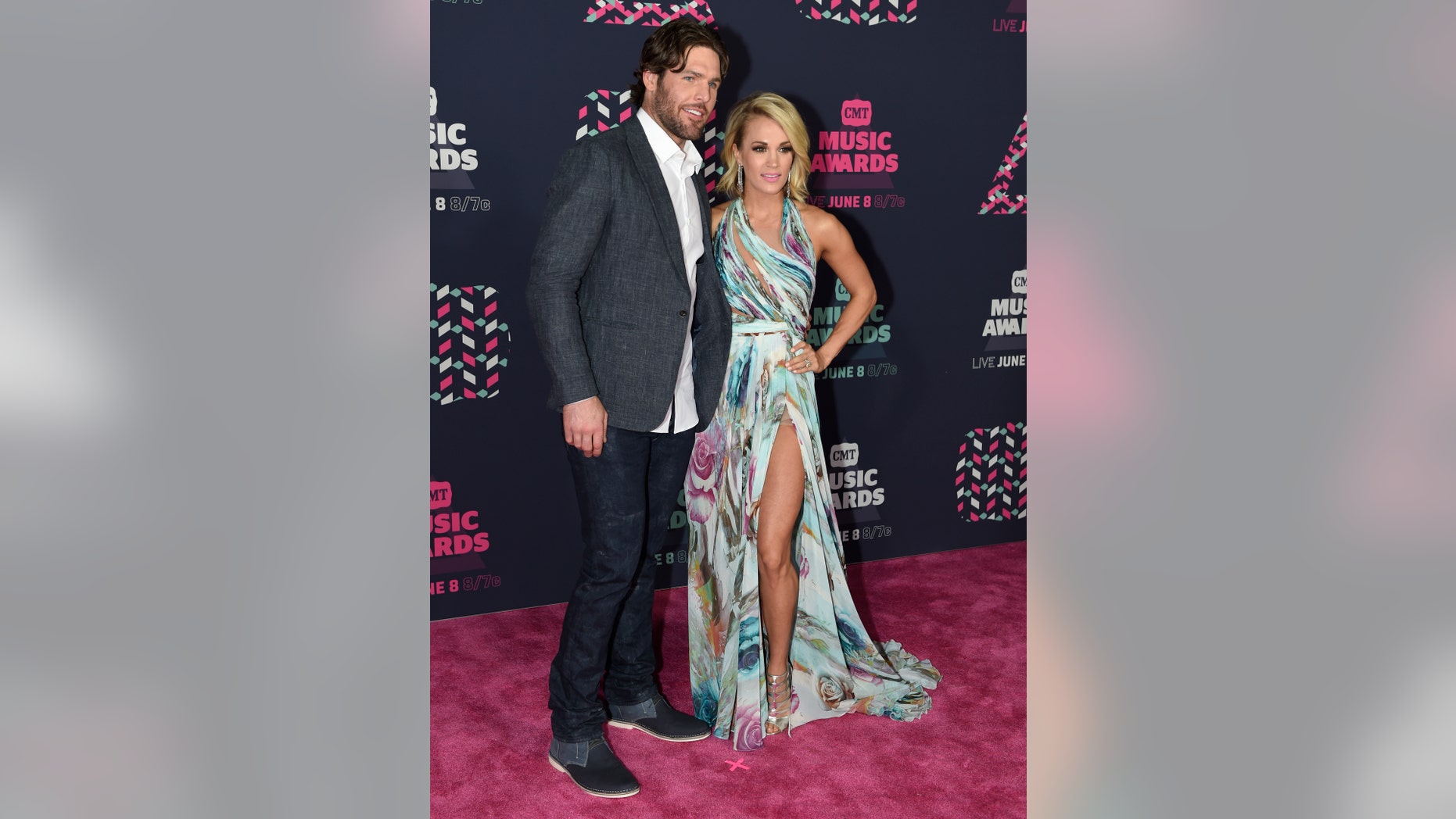 Mike Fisher, left, and Carrie Underwood arrive at the CMT Music Awards at the Bridgestone Arena on Wednesday, June 8, 2016, in Nashville, Tenn. (Photo by Sanford Myers/Invision/AP)