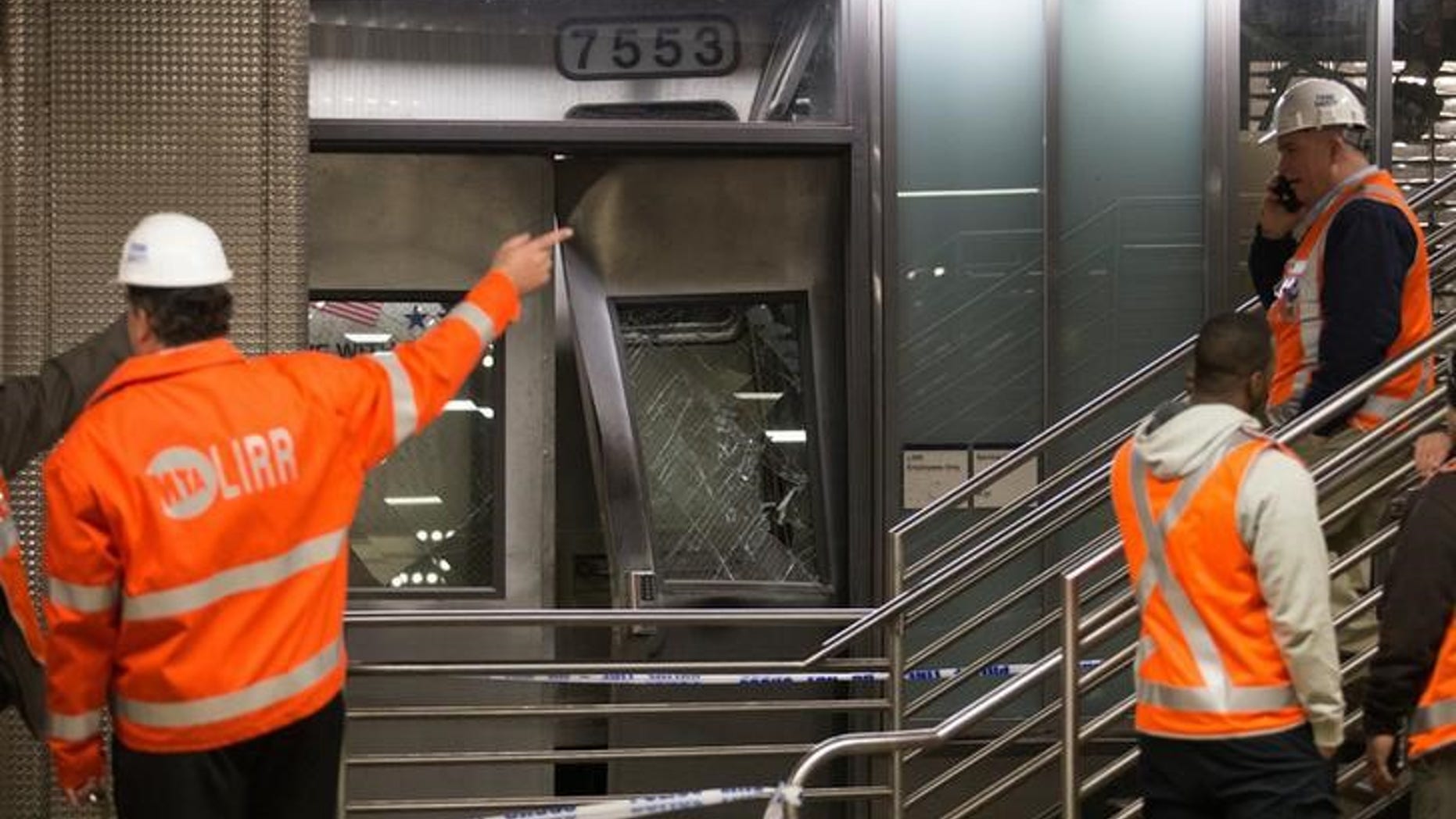 Officials investigate after a Long Island Railroad train derailed at Atlantic Terminal in Brooklyn, New York City