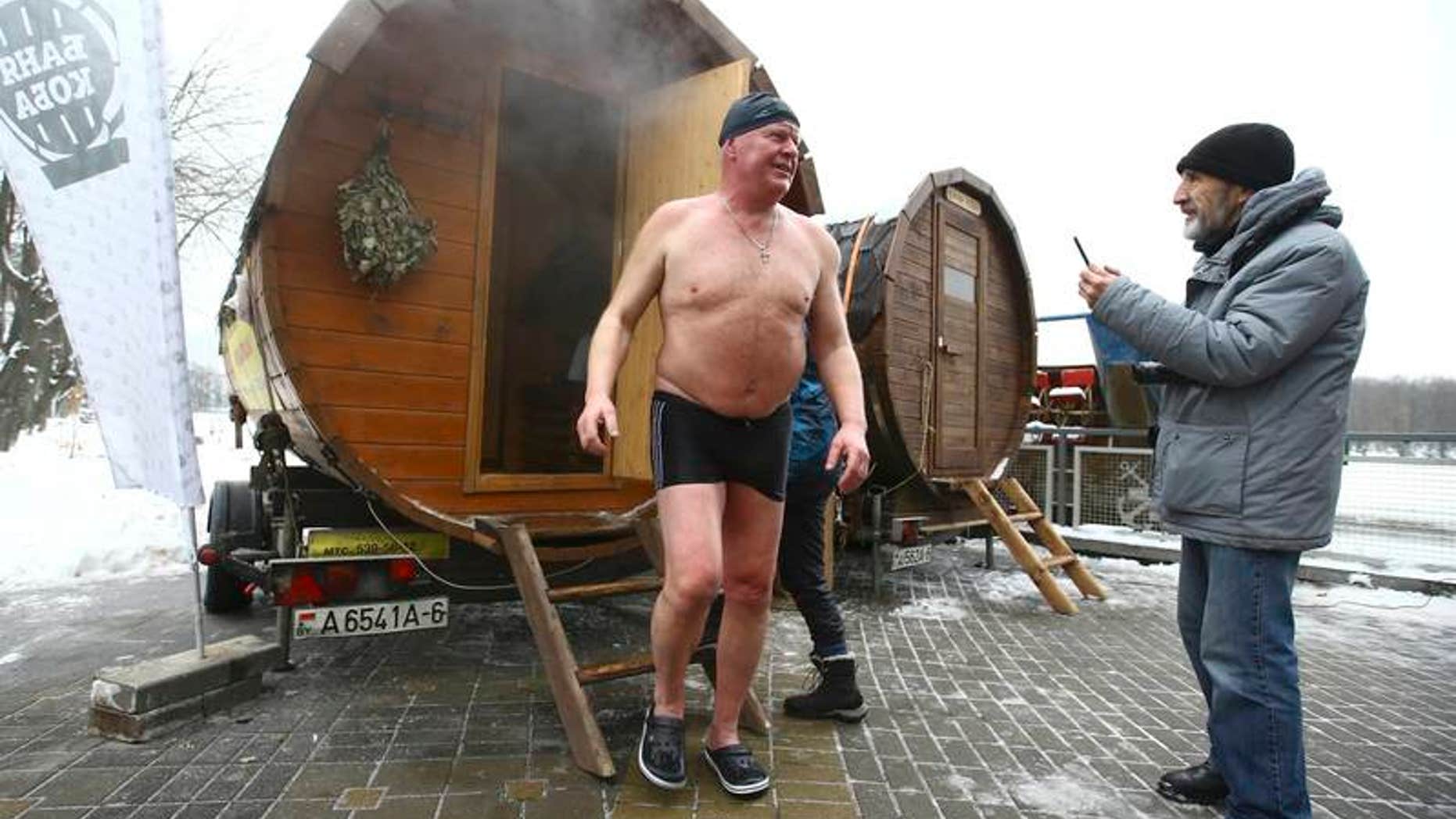 Man leaves sauna during Belarusian winter swimming championship in Minsk