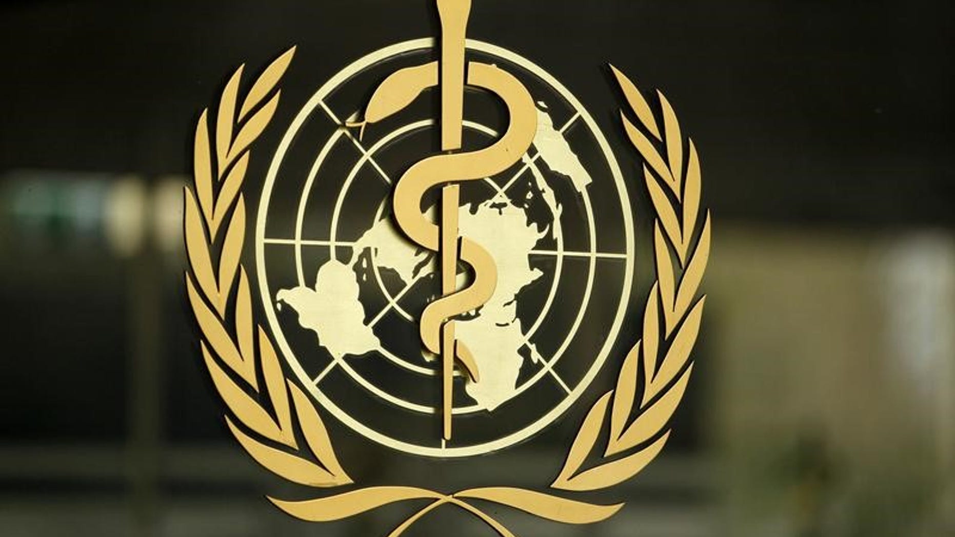 The WHO logo is pictured at the entrance of its headquarters in Geneva