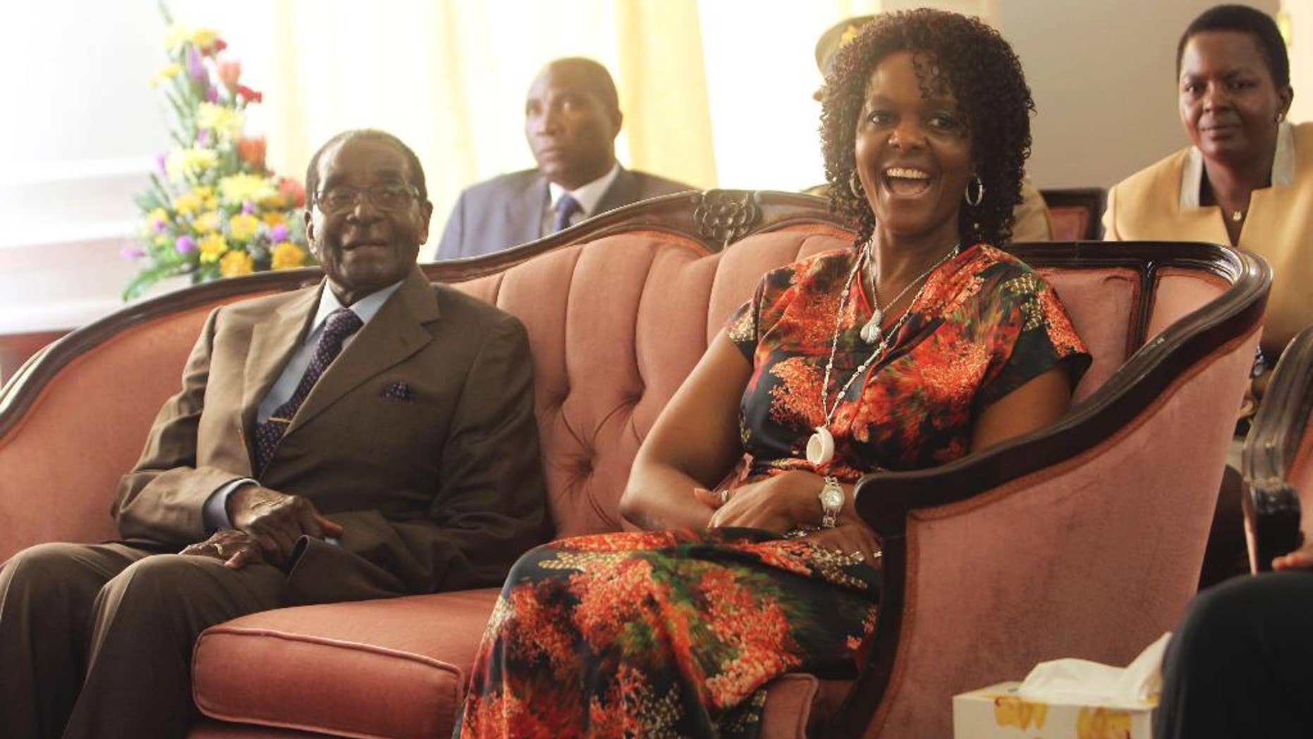 Zimbabwe's President Robert Mugabe and his wife Grace are seen during a birthday party for him in Harare, Feb, 22, 2016.