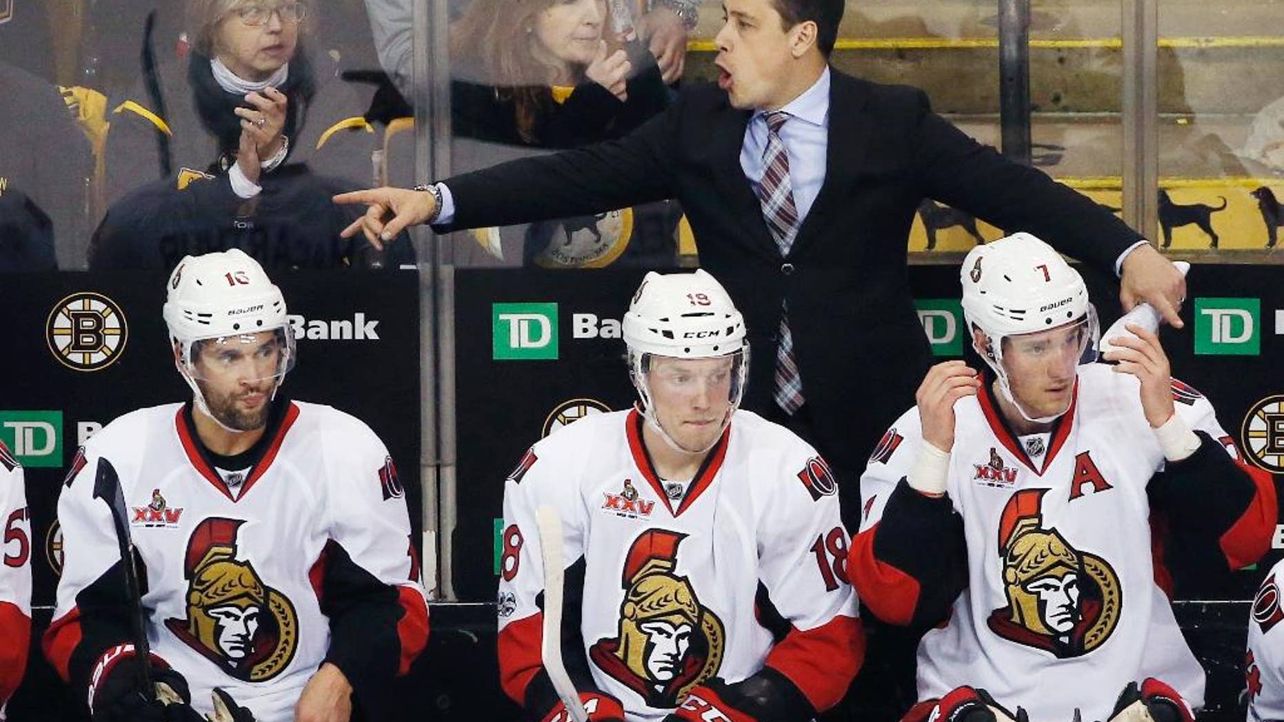 Ottawa Senators head coach Guy Boucher gives instructions during the third period in game six of a first-round NHL hockey Stanley Cup playoff series against the Boston Bruins, Sunday, April 23, 2017, in Boston. The Senators won 3-2 in overtime.(AP Photo/Michael Dwyer)