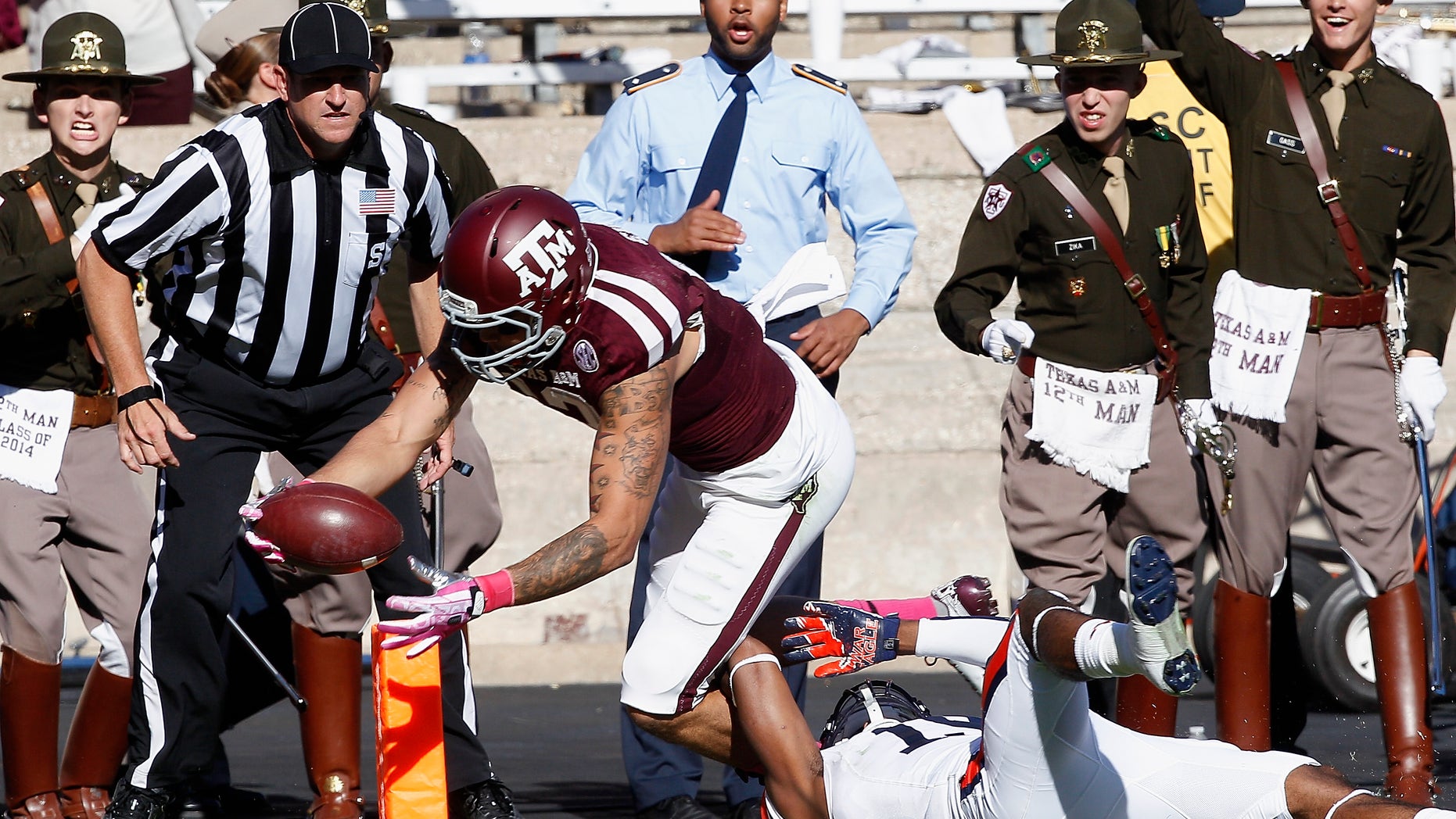 Texas A&M wide receiver Mike Evans (13) dives into the end zone for a touchdown in the quarter second quarter as Auburn defensive back Ryan White (19) cannot make the tackle during an NCAA college football game Saturday, Oct. 19, 2013, in College Station, Texas. (AP Photo/Bob Levey)