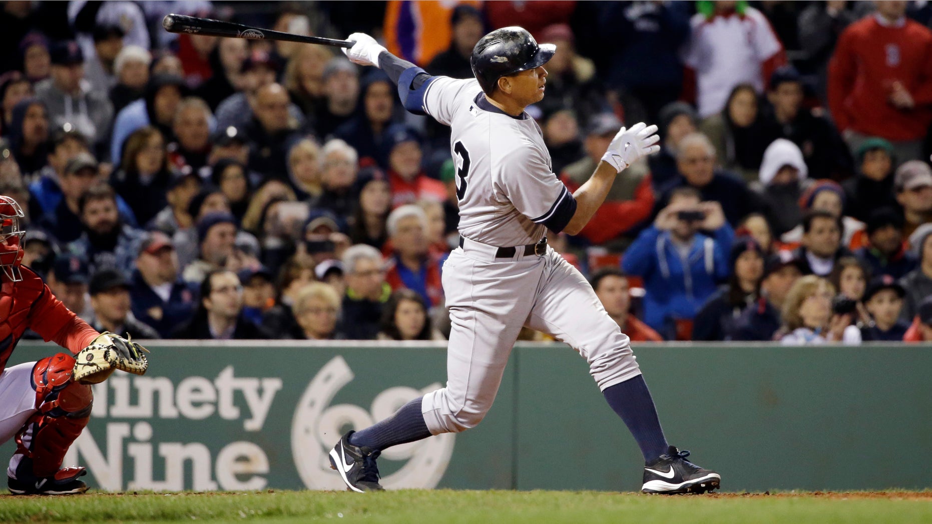 New York Yankees pinch hitter Alex Rodriguez hits a solo homer in the eighth inning of a baseball game against the Boston Red Sox at Fenway Park in Boston, Friday, May 1, 2015. Rodriguez has now tied slugger Willie Mays with 660 career home runs. (AP Photo/Elise Amendola)