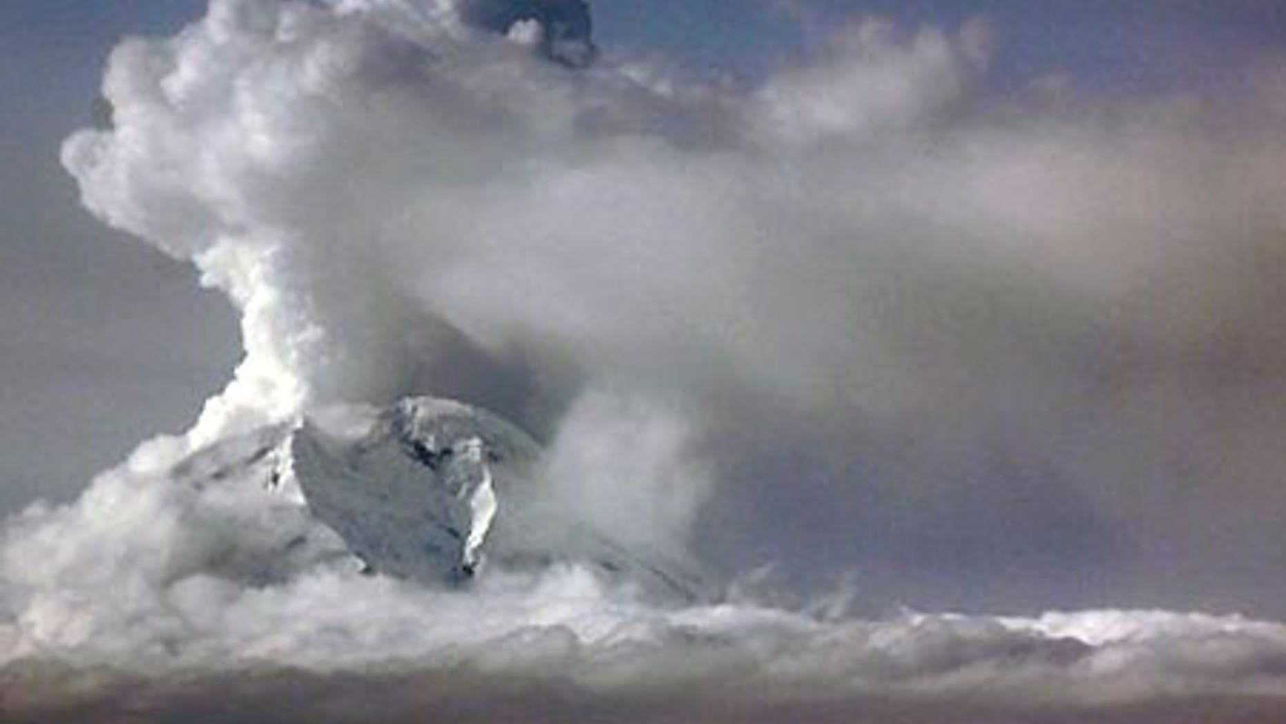 March 26: An ash cloud looms over Mount Redoubt.