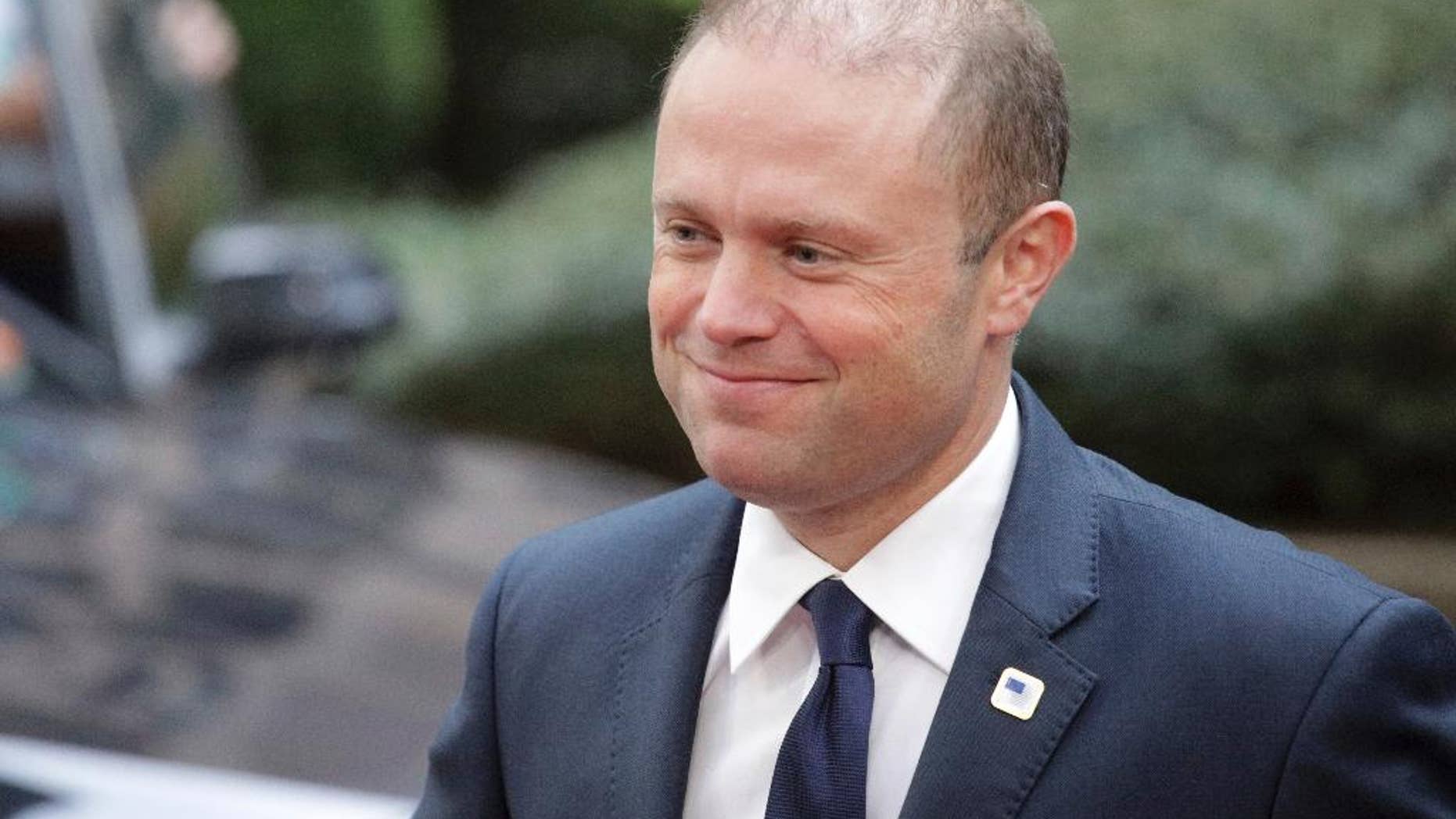 FILE - In this Thursday, Oct. 20, 2016 file photo, Malta's Prime Minister Joseph Muscat arrives for the EU summit in Brussels. Joseph Muscat, whose country is about to assume presidency of the European Union for six months from Jan. 1, 2017, says Britain's exit from the bloc will see both sides lose out. (AP Photo/Olivier Matthys, File)