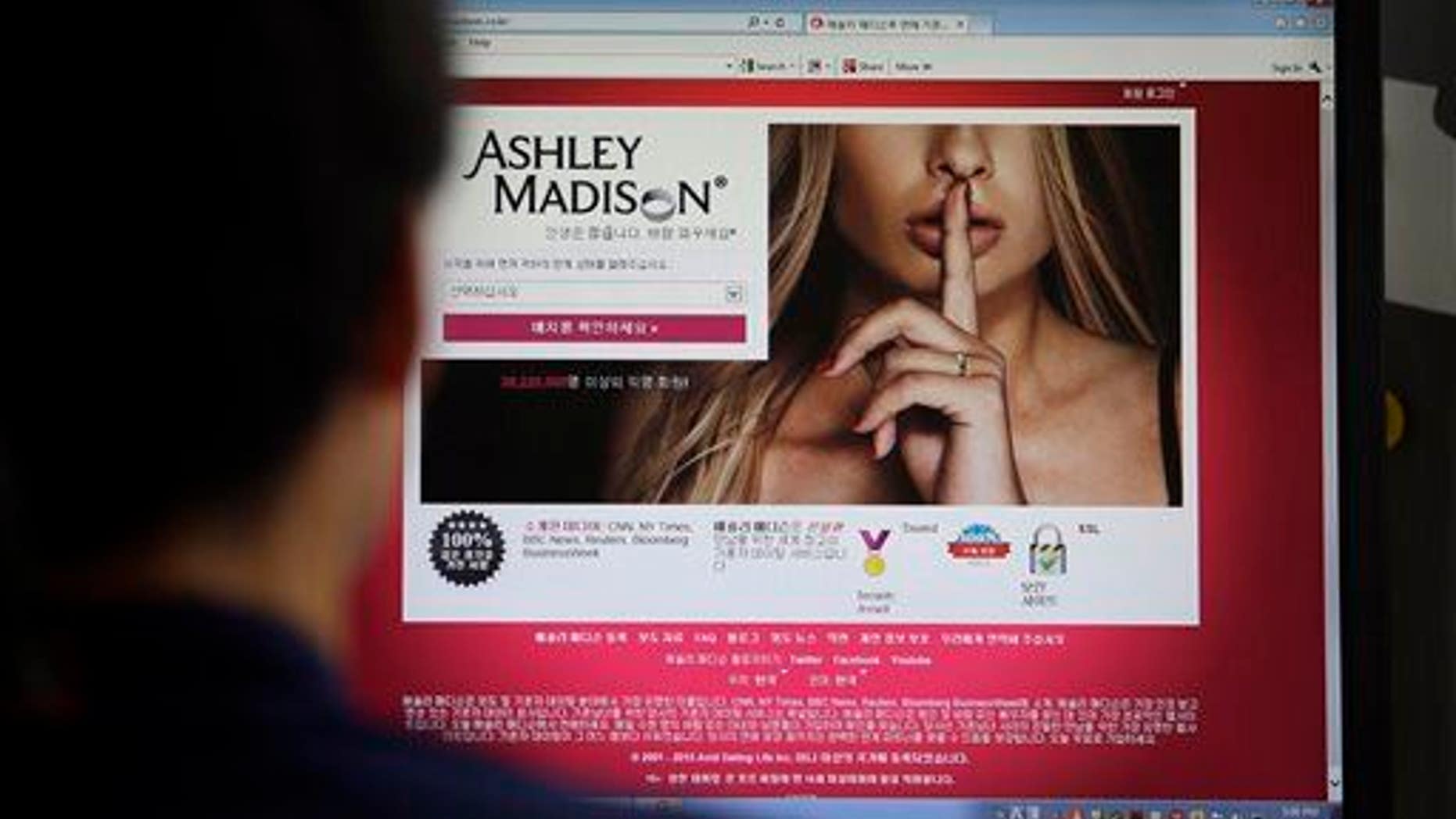FILE - In this June 10, 2015 photo, Ashley Madison's Korean web site is shown on a computer screen in Seoul, South Korea. (AP Photo/Lee Jin-man, File)