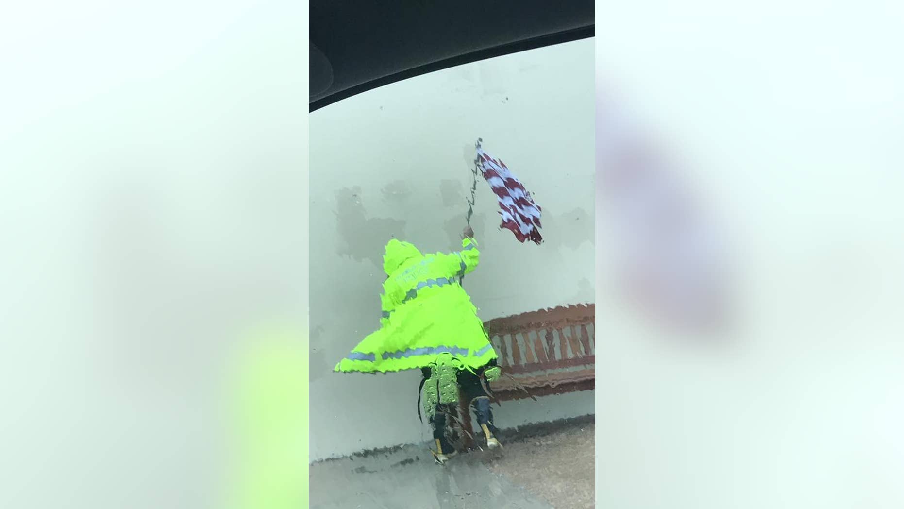 An Aransas Pass Police Department officer braved Hurricane Harvey on Friday to save an American flag.