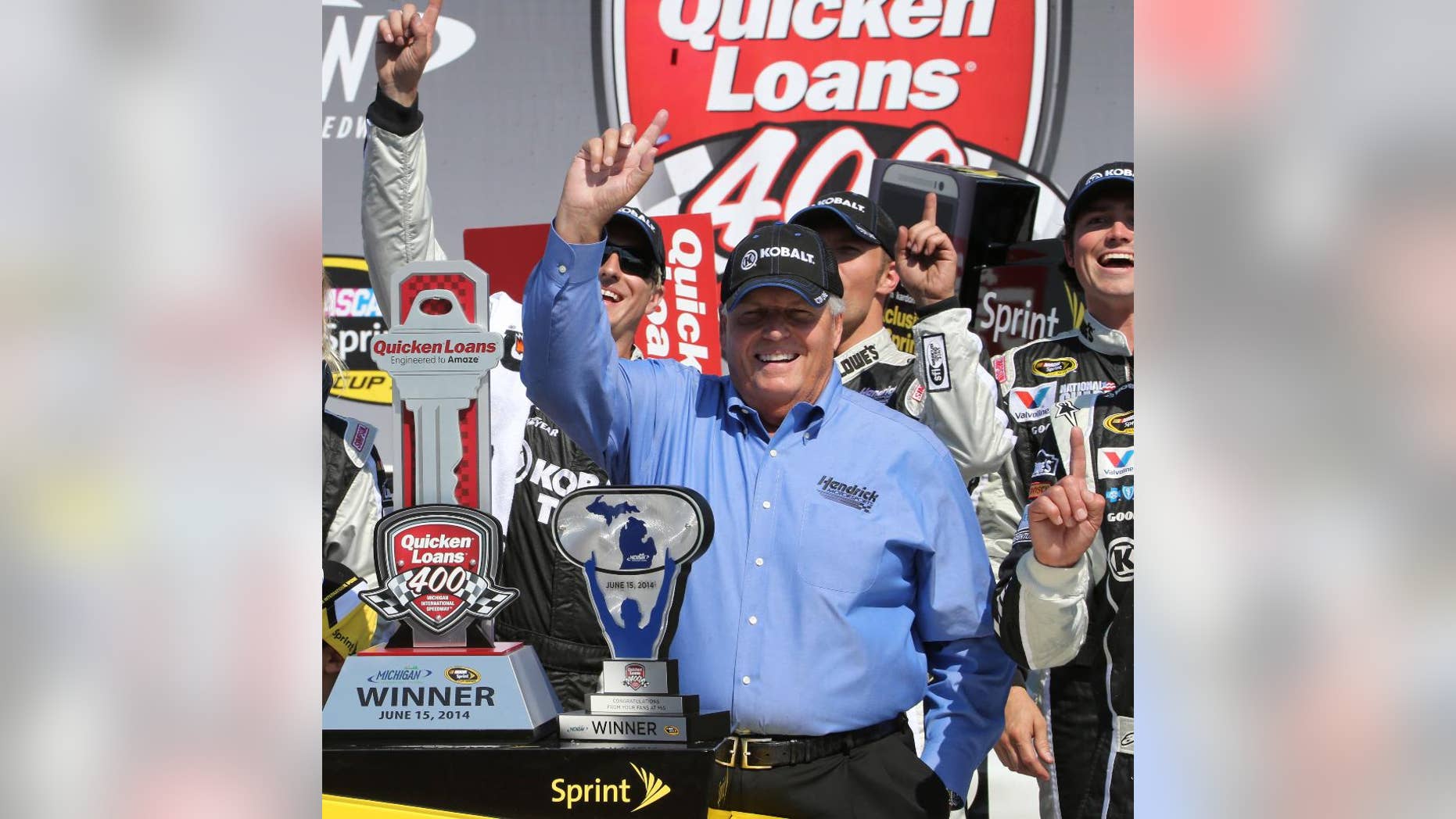 FILE - In this June 15, 2014, file photo, team owner Rick Hendrick celebrates in Victory Lane after Jimmie Johnson, not shown, won the NASCAR Quicken Loans 400 auto race at Michigan International Speedway in Brooklyn, Mich. One year after the Race Team Alliance was launched to much hype and curiosity, the owner's group is riding along without much fanfare. (AP Photo/Bob Brodbeck, File)