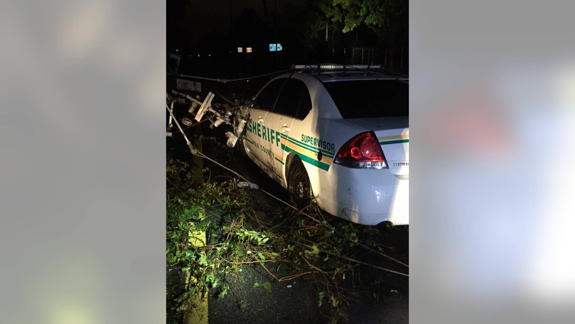 Two Florida first responders were rescued early Monday morning after being trapped in their car.
