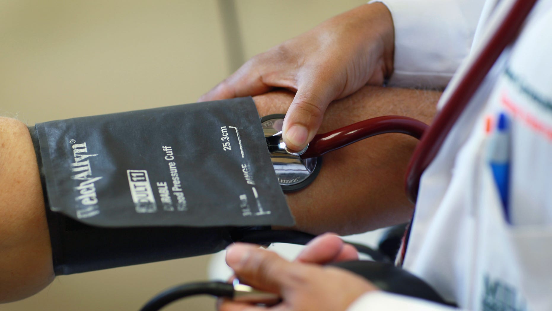 MIAMI - JANUARY 18: Dr. Olveen Carrasquillo, Chief of General Internal Medicine University of Miami, is checks the blood pressure of Juan Gonzalez at the University of Miamis Miller School of Medicine, as the United States House Republicans in Washington, DC were poised to approve a bill repealing the health care law that last year was signed into law overhauling the U.S. health care system on January 18, 2011 in Miami, Florida. Dr. Carrasquillo said that anyone that wants to roll back the gains made by the overhaul of the health care law should spend one morning in a public hospital and you would not want to repeal the bill. (Photo by Joe Raedle/Getty Images)