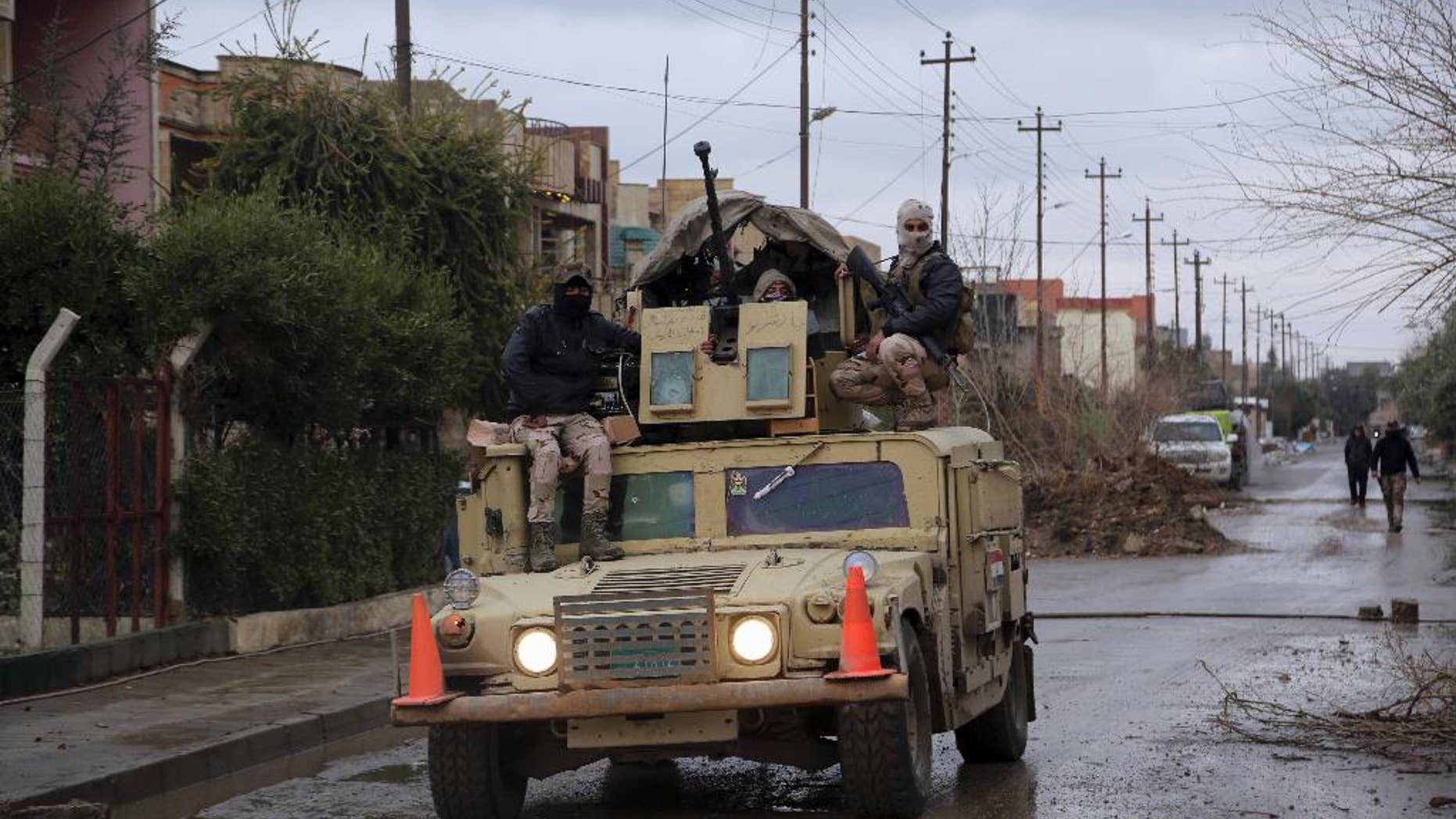 Iraq's Army forces patrol in the eastern side of Mosul, Iraq, Saturday, Jan. 28, 2017. (AP Photo/Khalid Mohammed)