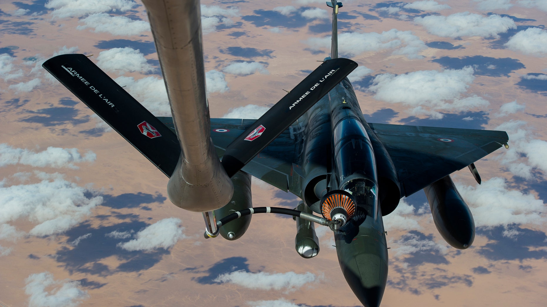 This picture released by the French Army Communications Audiovisual office (ECPAD) shows a French Mirage 2000 D aircraft refueling while flying to N'Djamena overnight January 11 to 12, after taking off from the French military base of Nancy. The battle to retake Mali's north from the al-Qaida-linked groups controlling it began in earnest Saturday, after hundreds of French forces deployed to the country and began aerial bombardments to drive back the Islamic extremists from a town seized earlier this week. (AP Photo/ R.Nicolas-Nelson, Ecpad)