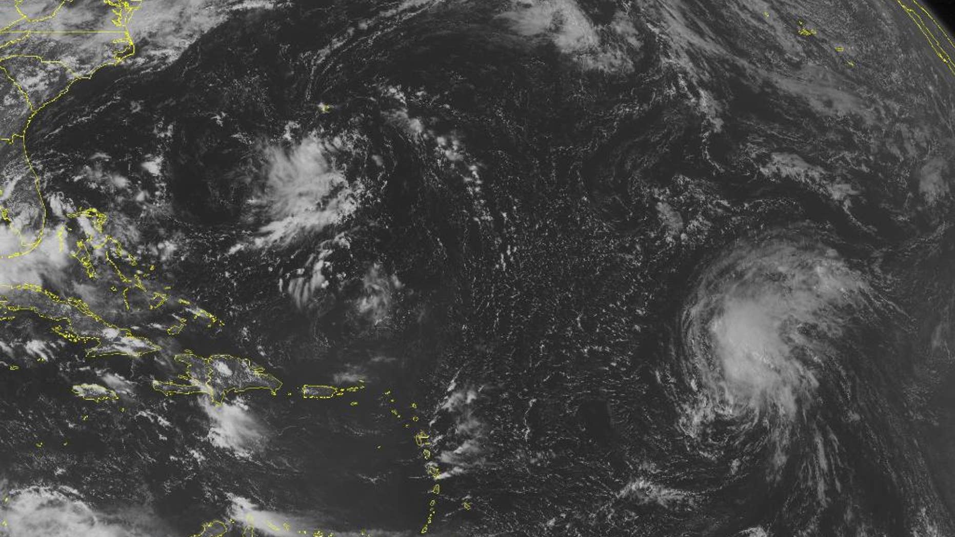 This NOAA satellite image taken Friday, Sept. 12, 2014, at 10:45 a.m. EDT shows a tropical disturbance over the western Bahamas and southern Florida with rain and thunderstorms. This system will move into the Gulf of Mexico. Tropical Storm Edouard continues to strengthen and move to the northwest and will continue to strengthen. A tropical wave moves westward across the central Caribbean Sea with rain showers and thunderstorms. (AP Photo/Weather Underground)