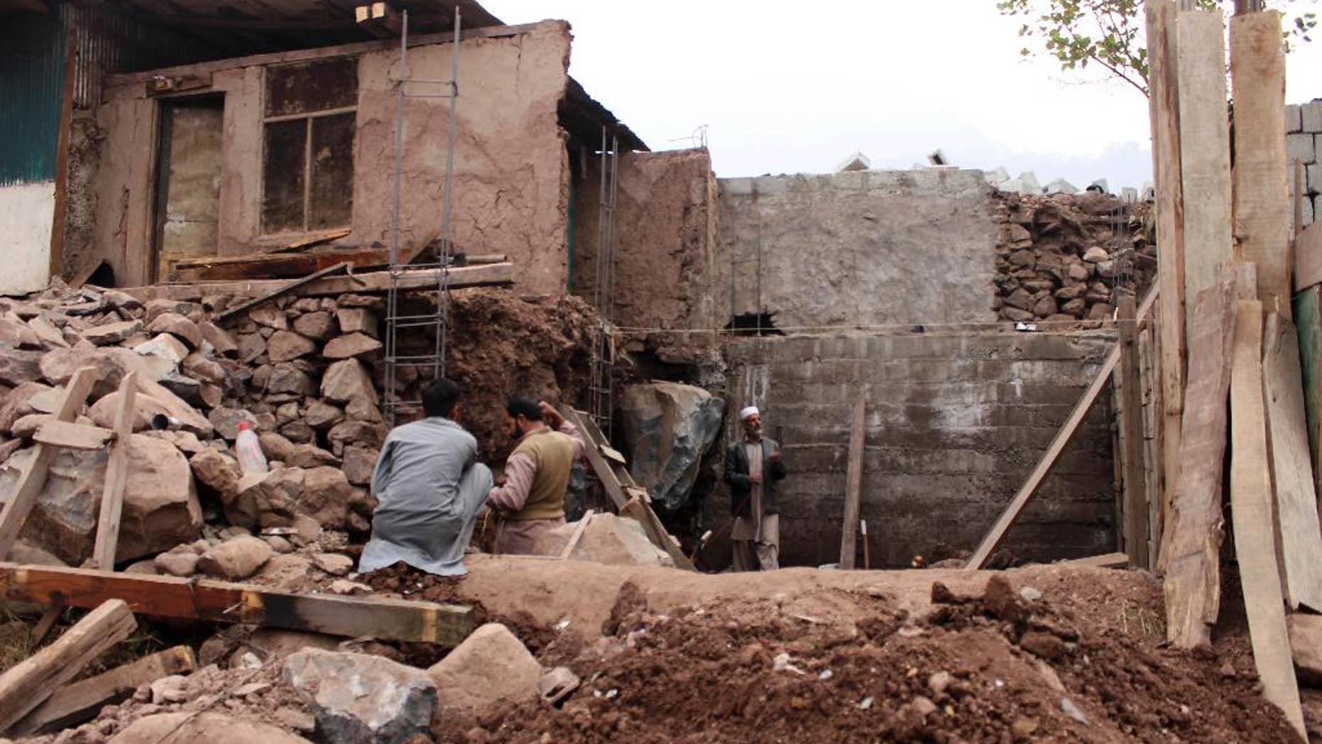 Pakistani villagers living at the Line of Control between Pakistan-Indian Kashmir, Chakoti, build concrete house in Pakistan, Monday, Nov. 21, 2016. Pakistan's military says Indian shelling has targeted several villages in Kashmir, killing scores of civilians and wounding others. (AP Photo/Roshan Mughal)