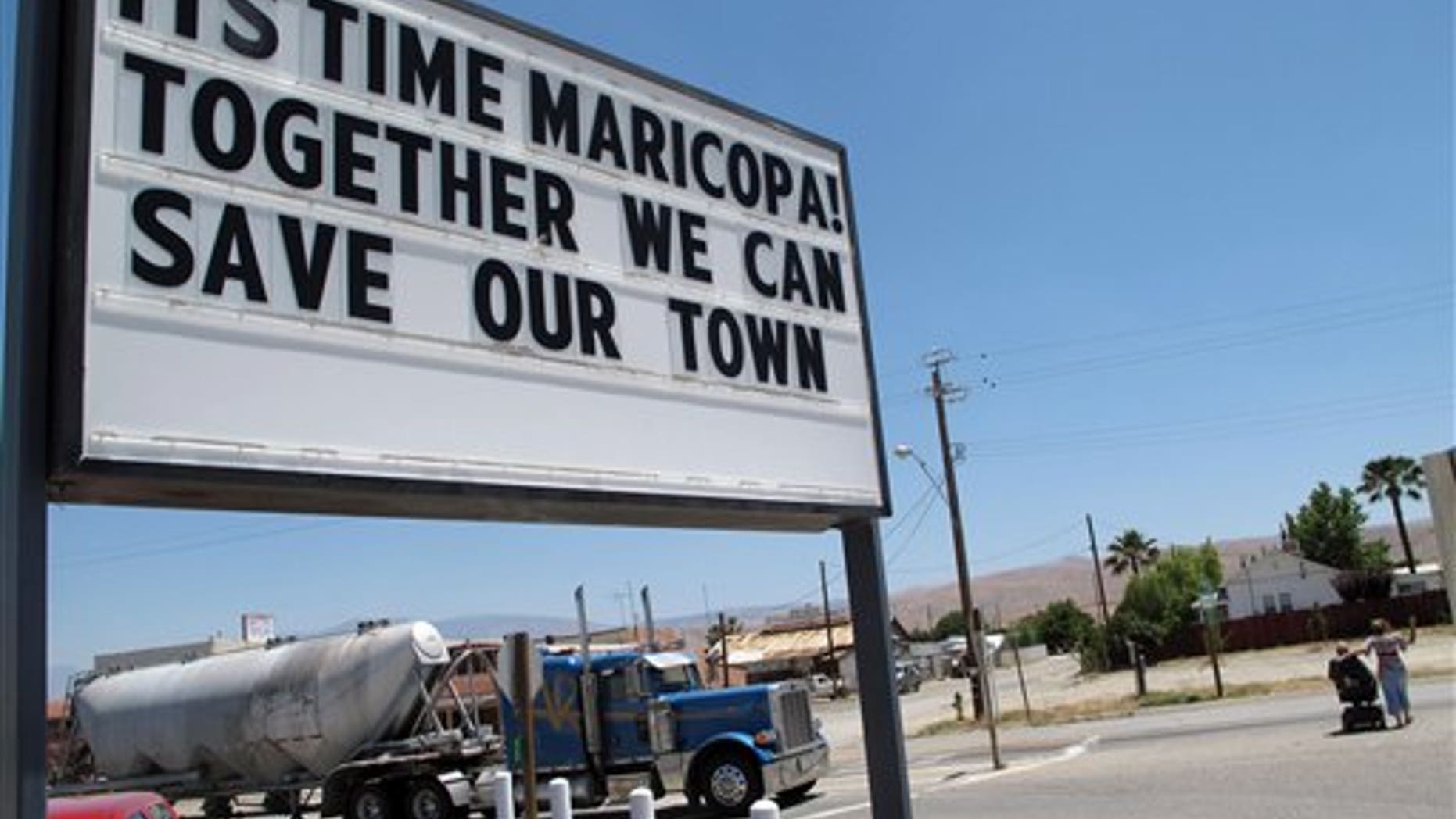 In this photo taken June 13, 2011, a sign is seen outside of the Shell gas station in Maricopa, Calif. Its own county grand jury has recommended that this tiny San Joaquin Valley community be dissolved because It's too poor to be a town anymore. Though surrounded by oil derricks, the Kern Coiunty community is hopelessly in debt, can't pay its bills and has no source of revenue to contribute to a recovery. (AP Photo/Tracie Cone)