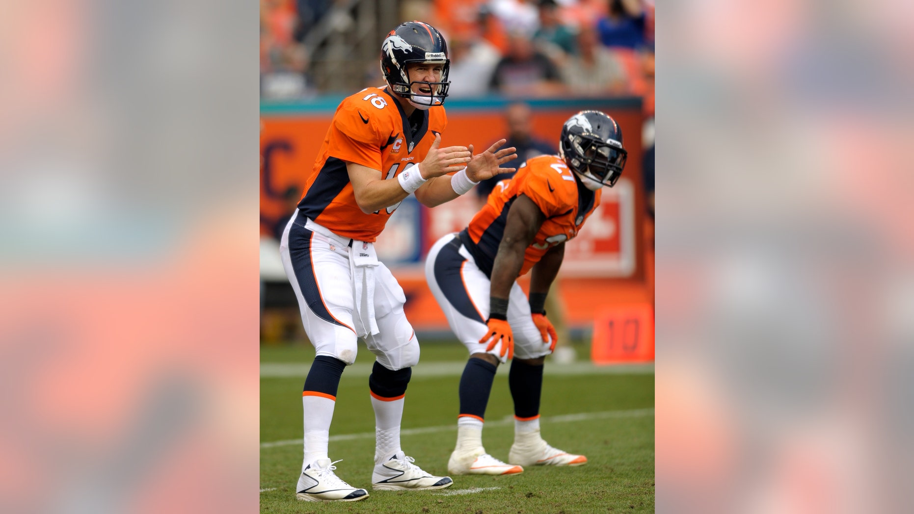 ADVANCE FOR WEEKEND, NOV. 16-17 = In this Sept. 29, 2013, photo, Denver Broncos quarterback Peyton Manning (18) calls the count as running back Knowshon Moreno listens, against the Philadelphia Eagles during an NFL football game in Denver. Moreno kept his starting job this season because he's best at protecting Manning. As Manning's protection has faltered a bit and teams have pressed the Denver receivers, Moreno has turned into his quarterback's favorite target. (AP Photo/Jack Dempsey)