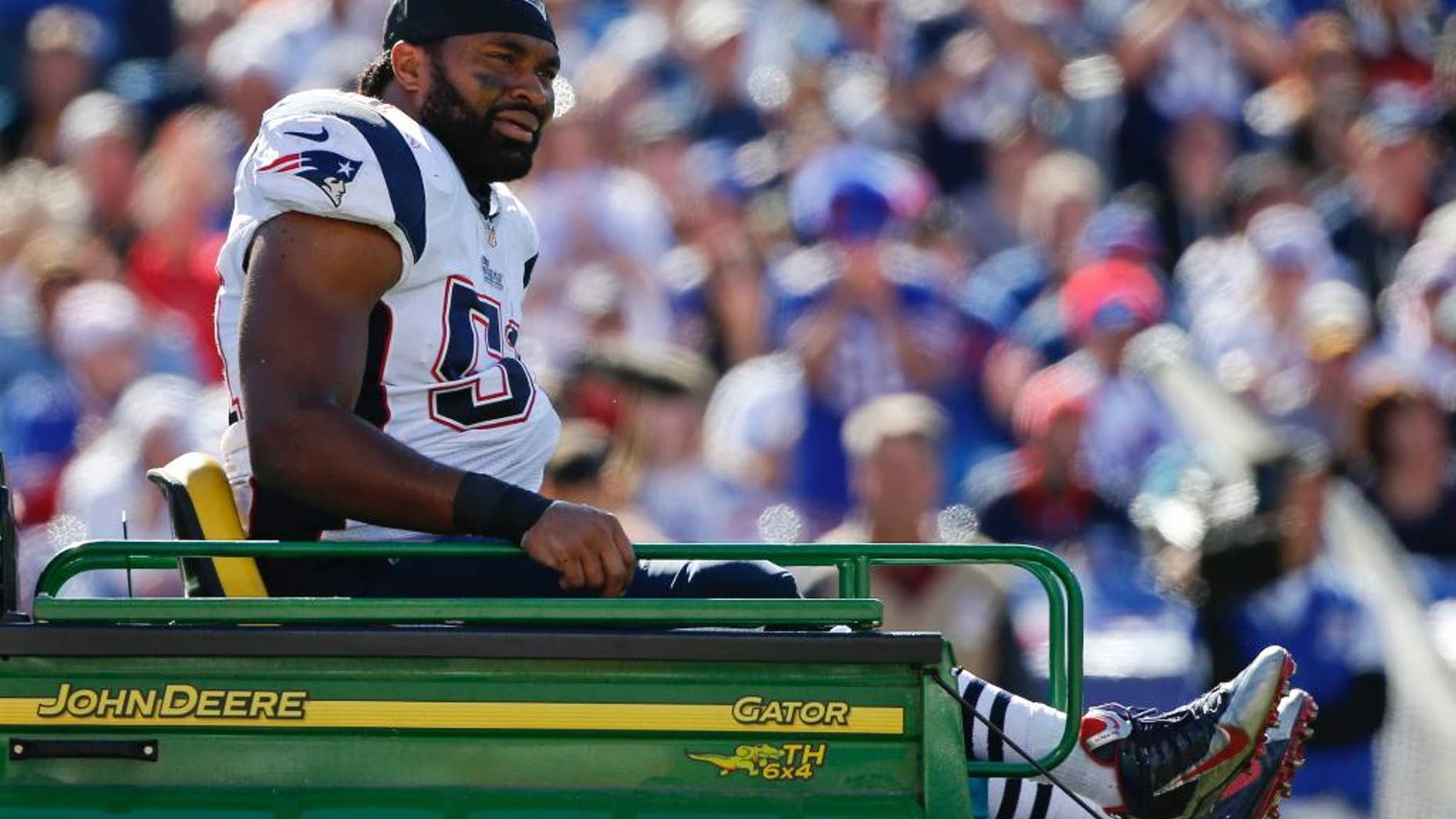 New England Patriots middle linebacker Jerod Mayo (51) is carted off the field after being injured on a play during the first half of an NFL football game against the Buffalo Bills, Sunday, Oct. 12, 2014, in Orchard Park, N.Y. (AP Photo/Mike Groll)