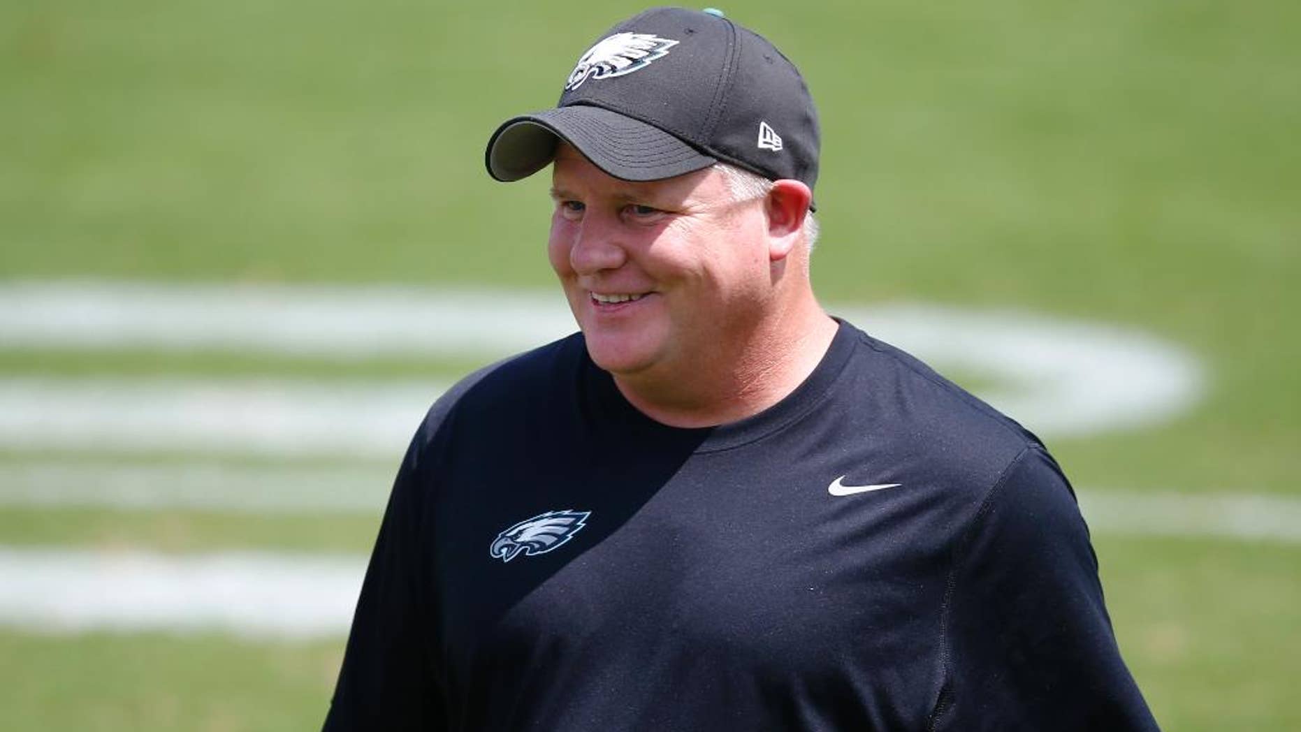 Philadelphia Eagles head coach Chip Kelly walks off the field during NFL football training camp Monday, Aug. 4, 2014, in Philadelphia. (AP Photo/Matt Rourke)