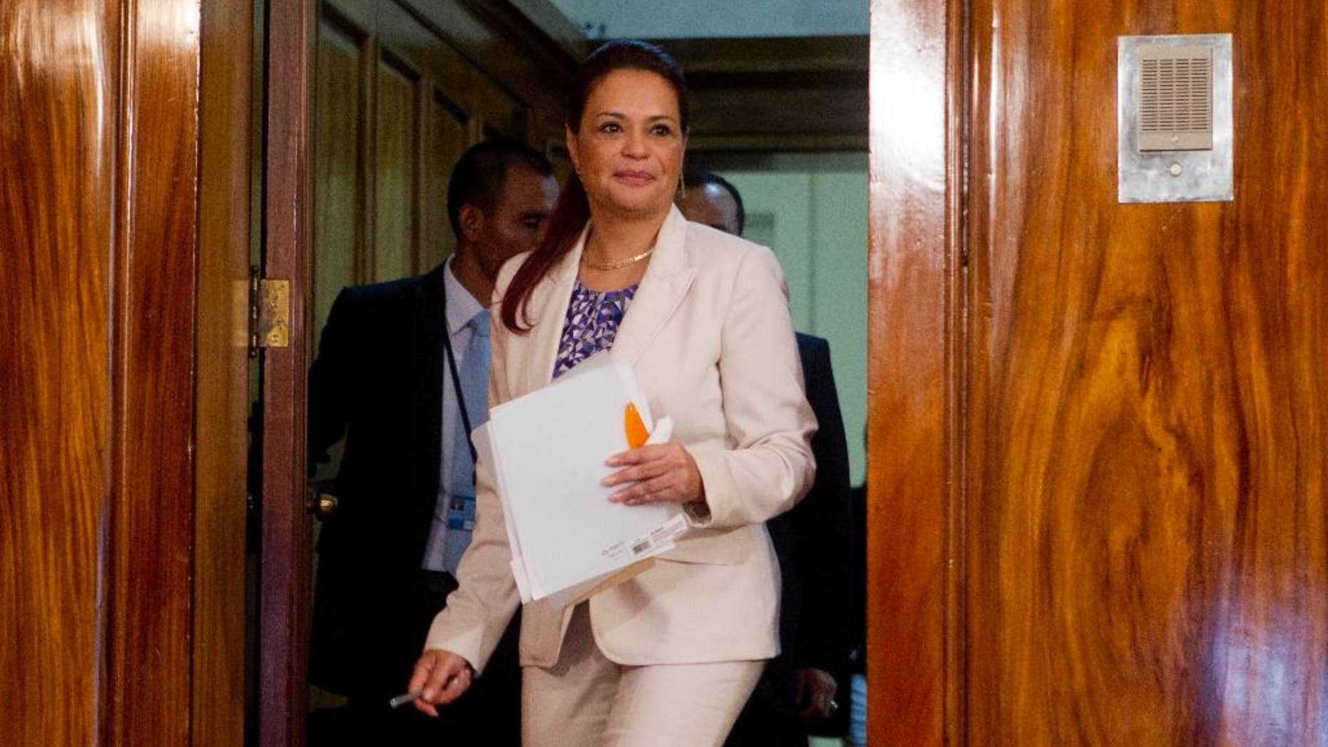 FILE - In this April 19, 2015 file photo, Guatemala's Vice President Roxana Baldetti arrives to a press conference at the presidential house in Guatemala City. A Guatemalan court has frozen bank accounts linked to former Vice President Roxana Baldetti, who resigned in May after a corruption scandal that reached into her office. (AP Photo/Moises Castillo, File)