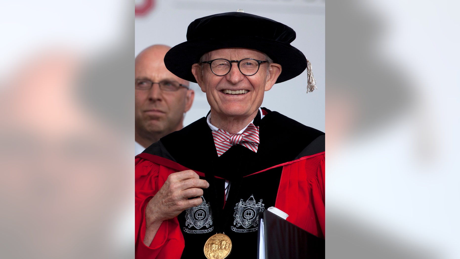 This photo made Sunday, May 5, 2013, shows Ohio State president E. Gordon Gee during the Ohio State University spring commencement in Columbus, Ohio. Gee told a university committee last December that Notre Dame wasn’t invited to join the Big Ten because they’re not good partners while also jokingly saying that “those damn Catholics” can’t be trusted. (AP Photo/Carolyn Kaster)