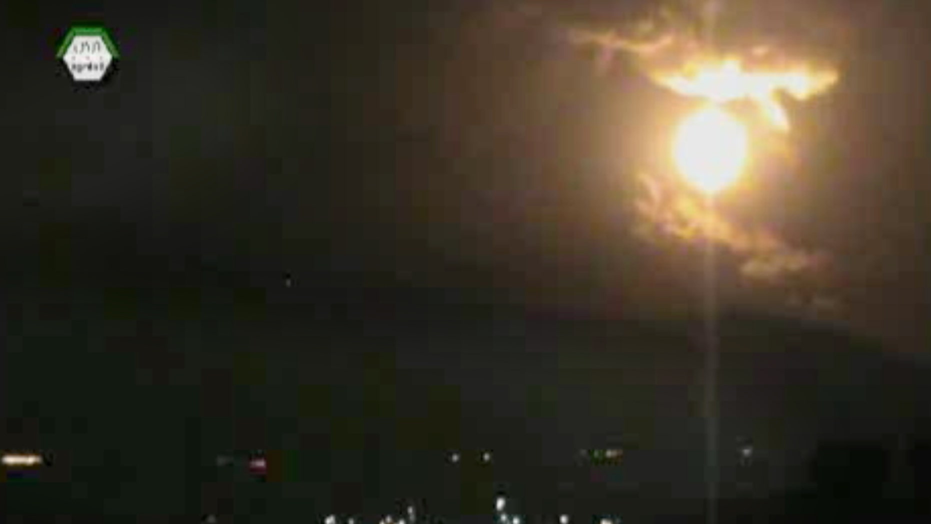 In this image taken from video obtained from the Ugarit News, which has been authenticated based on its contents and other AP reporting, a Israeli airstrikes hit Damascus, Syria, early Sunday, May 5, 2013. Israeli warplanes struck areas in and around the Syrian capital Sunday, setting off a series of explosions as they targeted a shipment of highly accurate, Iranian-made guided missiles believed to be on their way to Lebanon's Hezbollah militant group, officials and activists said. The attack, the second in three days, signaled a sharp escalation of Israel's involvement in Syria's bloody civil war. Syria's state media reported that Israeli missiles struck a military and scientific research center near the Syrian capital and caused casualties. (AP Photo/Ugarit News via AP video)