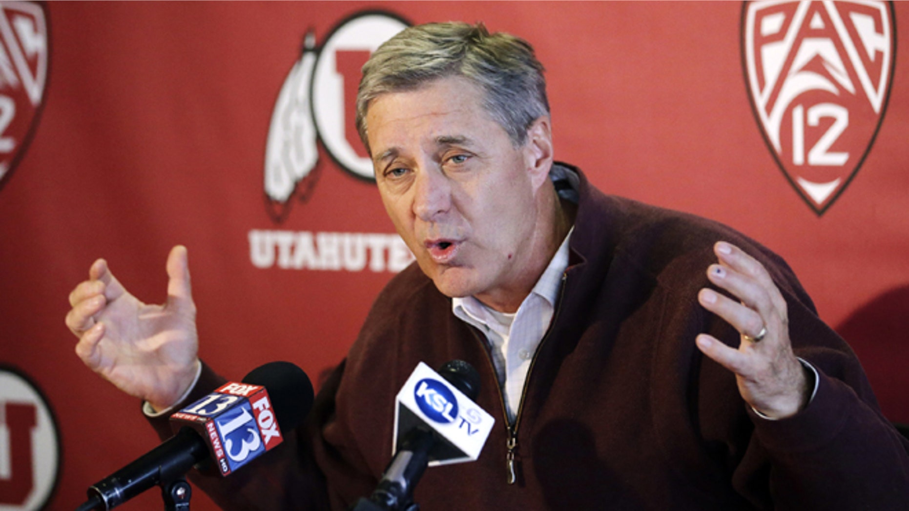 Utah athletic director Chris Hill announces the suspension of swim coach Greg Winslow during a college news conference, Thursday, Feb. 28, 2013, in Salt Lake City. The suspension comes amidst allegations that Winslow sexually abused an teenage female swimmer he coached in Arizona six years ago. (AP Photo/Rick Bowmer)