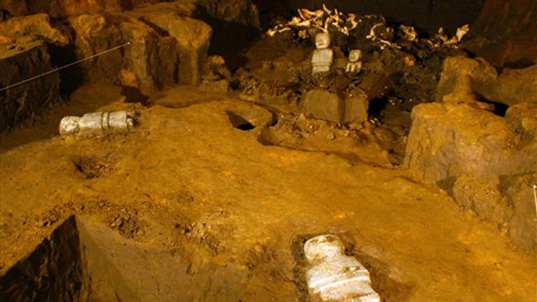 This May 22, 2014 photo released by Mexico's National Institute of Anthropology and History (INAH) shows sculptures unearthed at the Teotihuacan archeological site in Mexico. Mexican archaeologists have concluded a yearslong exploration of a tunnel sealed nearly 2,000 years ago at the ancient city of Teotihuacan and found thousands of relics. Teotihuacan dominated central Mexico centuries before the rise of the Aztecs in the 14th century. (AP Photo/Proyecto Tlalocan, INAH)