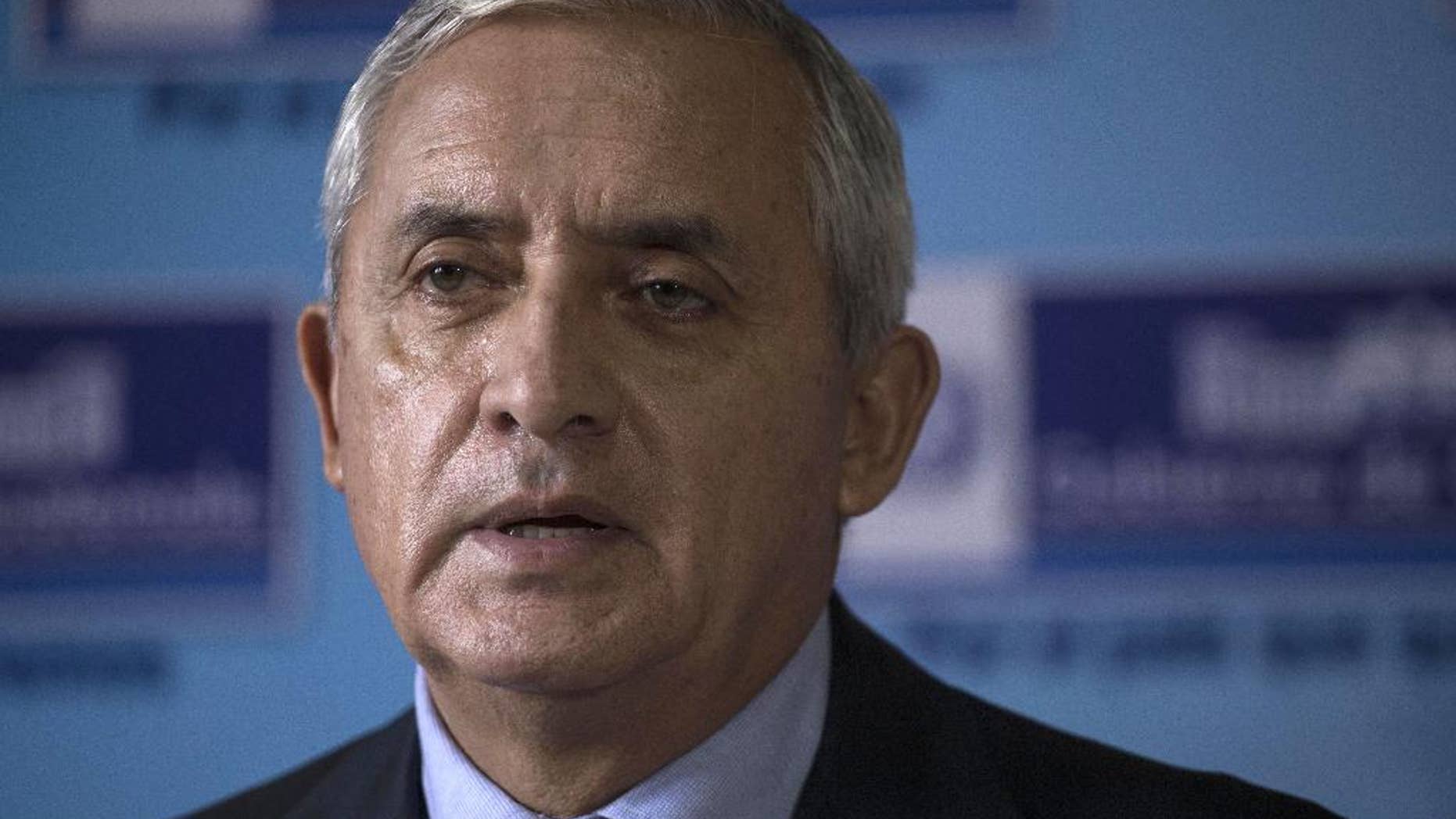 FILE - In this June 11, 2015 file photo, Guatemala's President Otto Perez Molina gives a press conference at the Interior Ministry in Guatemala City. Guatemala's constitutional court has temporarily blocked an effort to strip Perez Molina of immunity as corruption investigations advance. (AP Photo/Luis Soto, File)