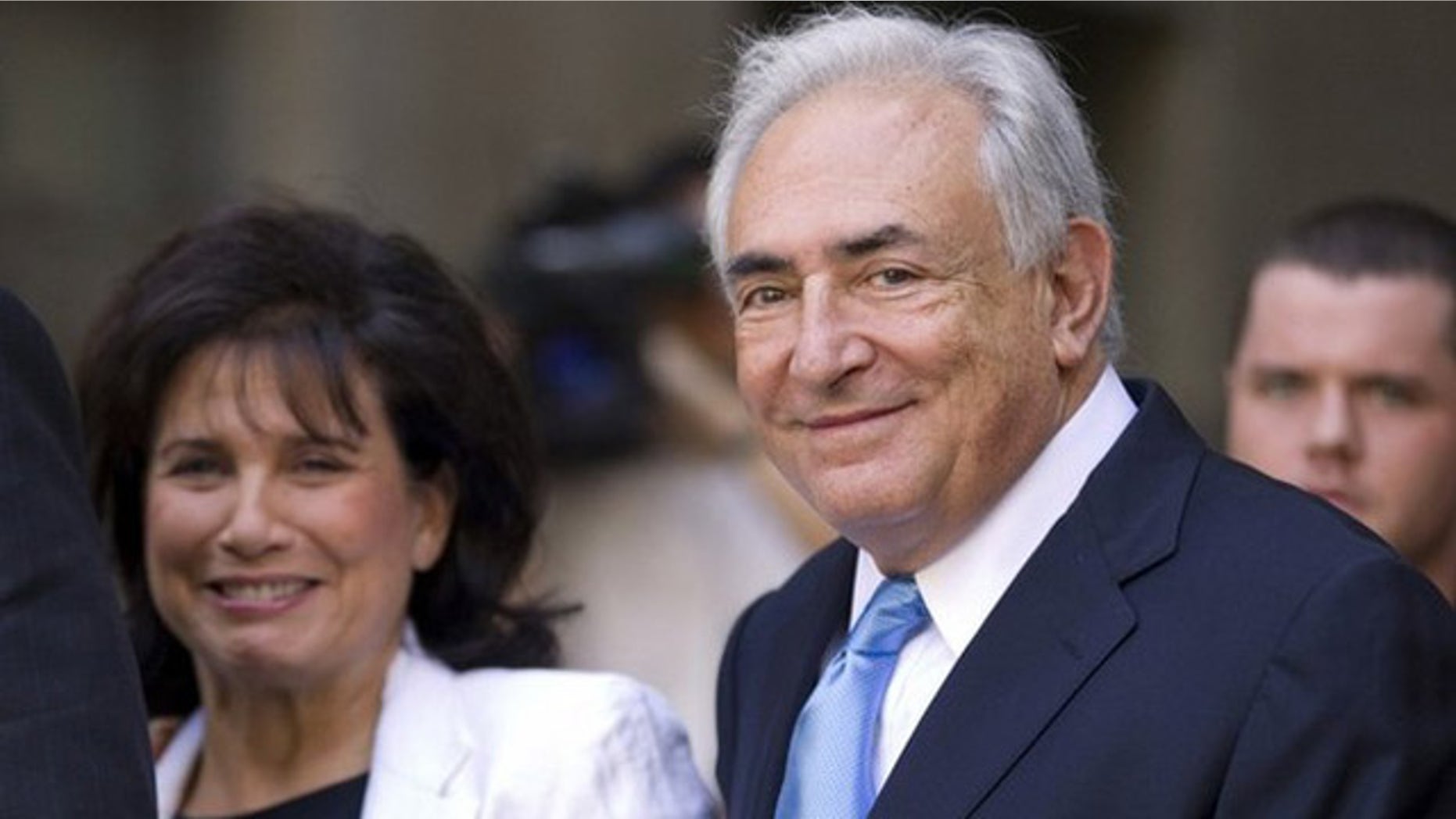 July 1: Former IMF chief Dominique Strauss-Kahn smiles as he and his wife Anne Sinclair depart a hearing at the New York State Supreme Courthouse in New York. Strauss-Kahn was released without bail on Friday after a dramatic court hearing where the sexual assault case against him appeared to shift in his favor.