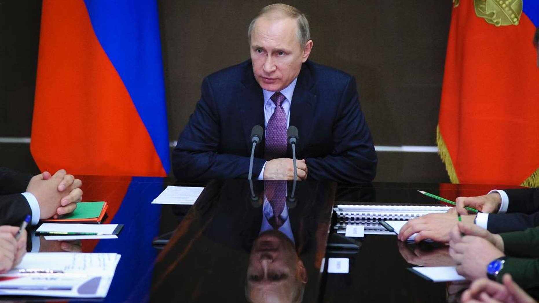 Russian President Vladimir Putin chairs a meeting on aviation industries in the Bocharov Ruchei residence in Sochi, Russia, Thursday, May 12, 2016. (Mikhail Klimentyev/Sputnik, Kremlin Pool Photo via AP)
