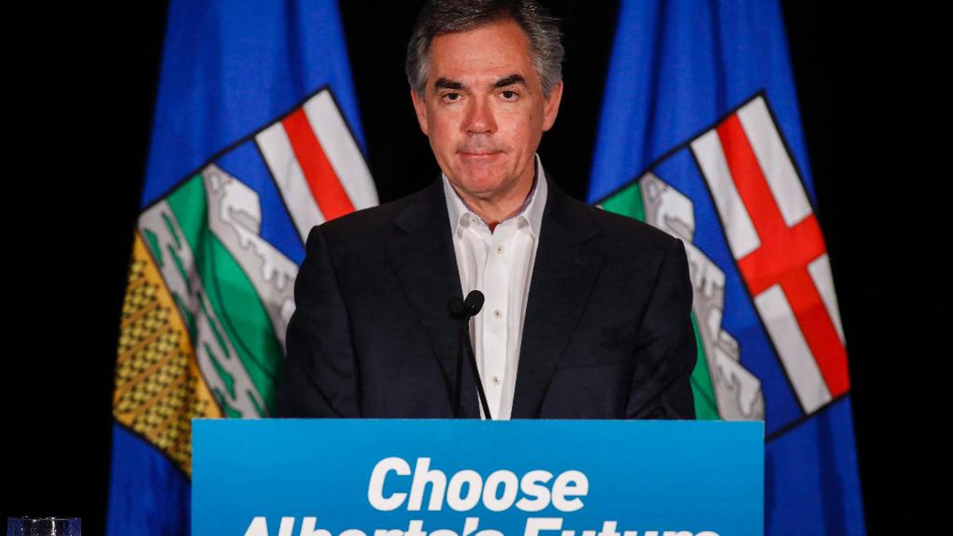 FILE - In this May 5, 2015 file photo, Alberta PC Party leader Jim Prentice speaks to party faithful in Calgary, Alberta, Canada. Prentice and three others died in the crash of a small plane in southern British Columbia. A senior government official confirmed Prentice died in the crash late Thursday, Oct. 13, 2016. The official spoke on condition of anonymity ahead of a statement to be released by the family. (Jeff McIntosh/The Canadian Press via AP)