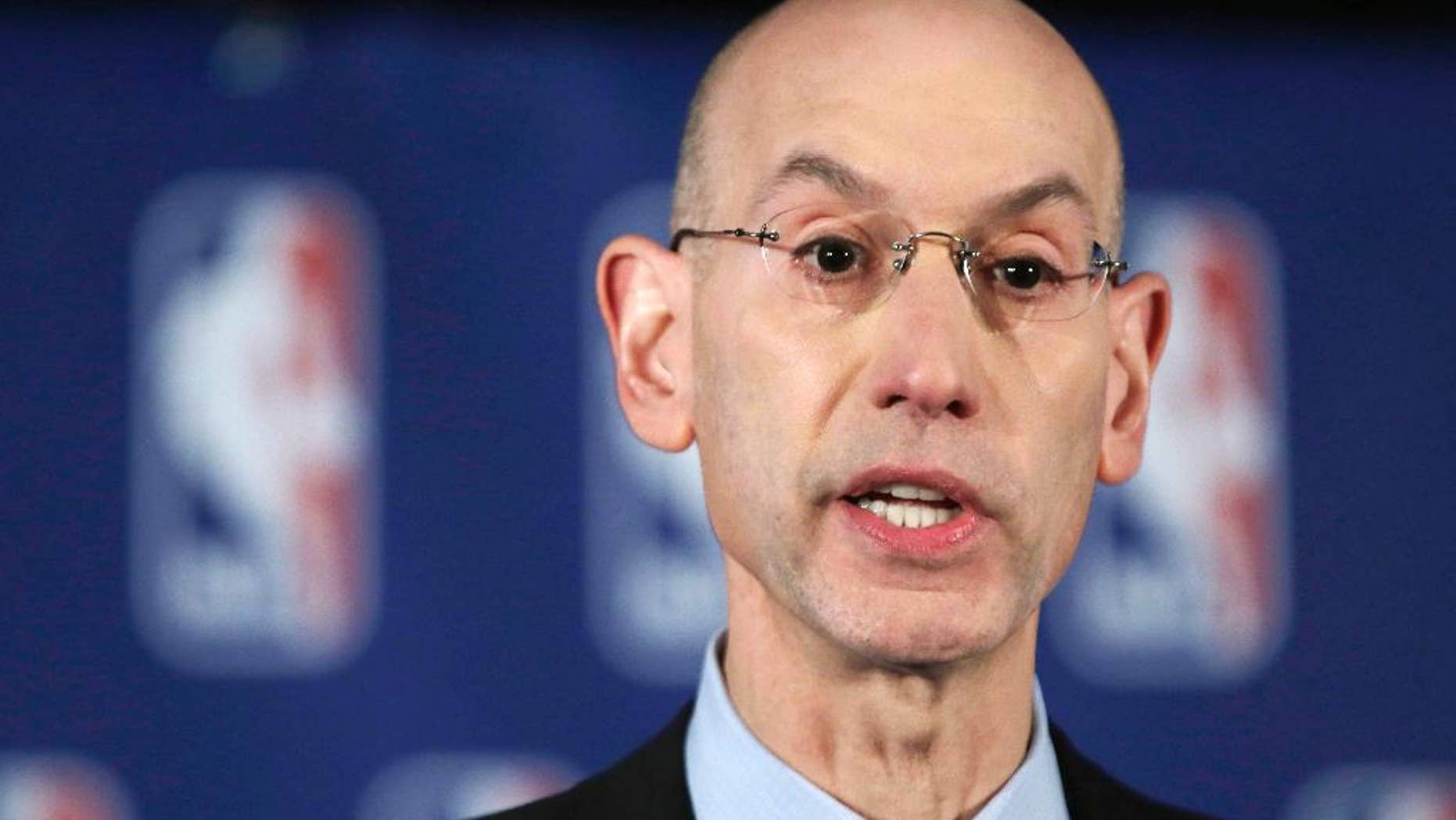 NBA Commissioner Adam Silver addresses the media during a news conference, in New York, Tuesday, April 29, 2014. Silver announced that he is banning Los Angeles Clipper owner Donald Sterling for life from the Clippers organization over racist comments in a recording. (AP Photo/Richard Drew)