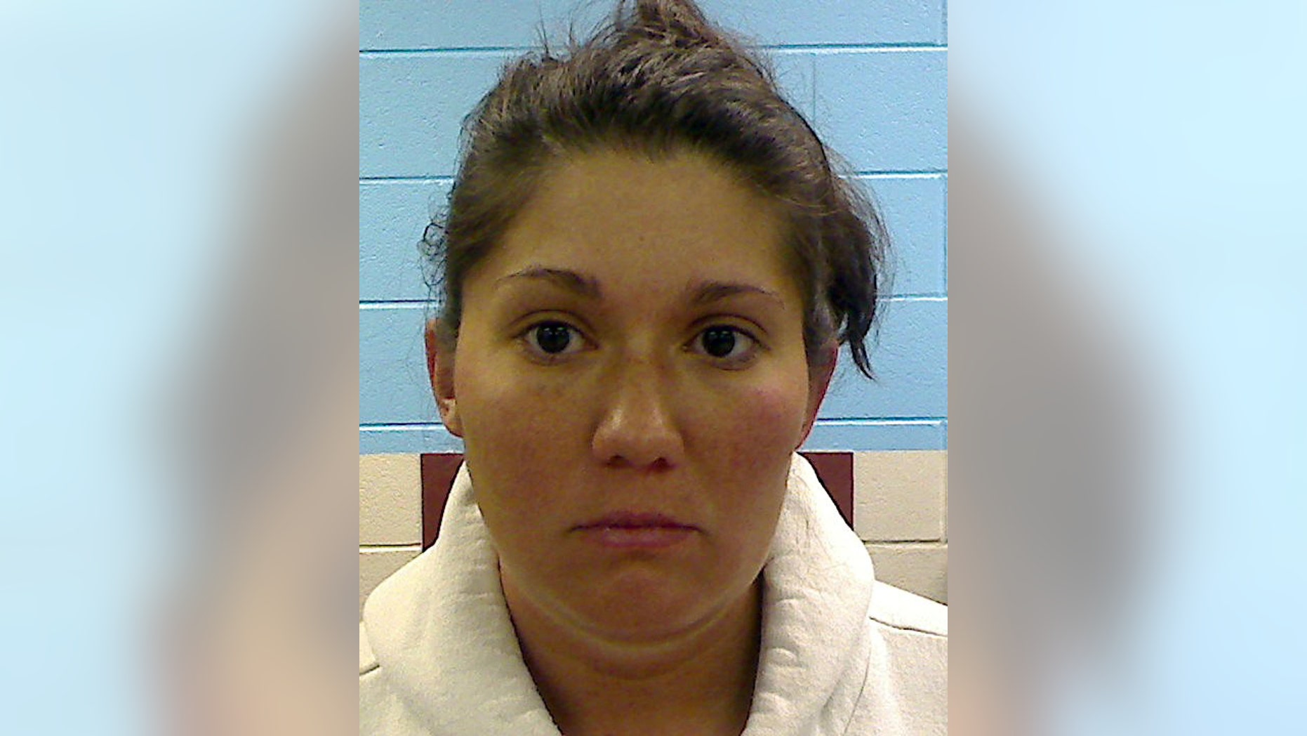 FILE - This photo providedby the Etowah County Sheriff's Dept. shows Jessica Mae Hardin, stepmother to 9-year-old Savannah Hardin. A jury convicted grandmother Joyce Hardin Garrard late Friday, March 20, 2015, in the February 2012 death of Savannah Hardin, siding with prosecutors who depicted Garrard as a domineering taskmaster so enraged over a lie about candy that she made the girl run until she dropped. Jessica Hardin, is free on bond awaiting trial on a murder charge for allegedly failing to intervene as Garrard made Savannah run. No trial date is set for Hardin, who has pleaded not guilty. (AP Photo/Etowah County Sheriff's Office, File)