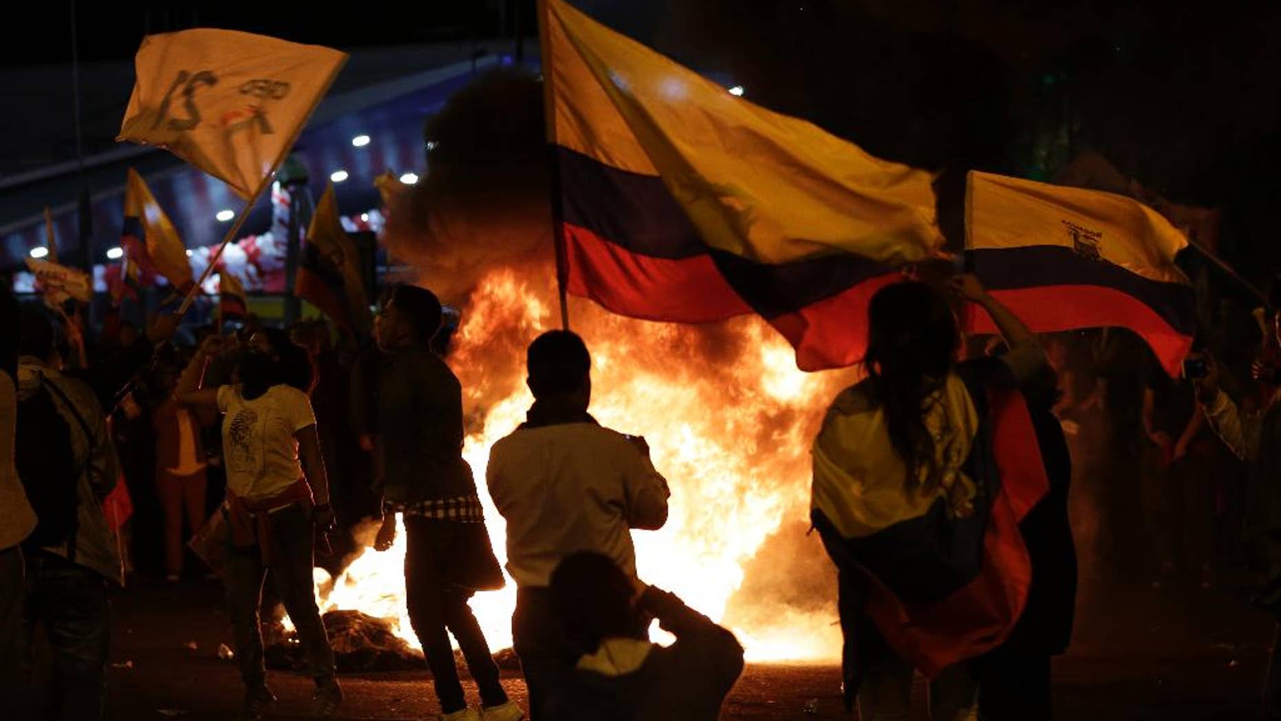 Supporters of presidential candidate Guillermo Lasso protest near the Electoral National Council in Quito, Ecuador, Tuesday, April 4, 2017. Juan Pablo Pozo, president of the electoral council, announced the razor-thin election win by Moreno in a nationwide broadcast on radio and television. He said the results were “official, irreversible” with 99.65 percent of the votes counted. Lasso is demanding a recount. (AP Photo/Dolores Ochoa)